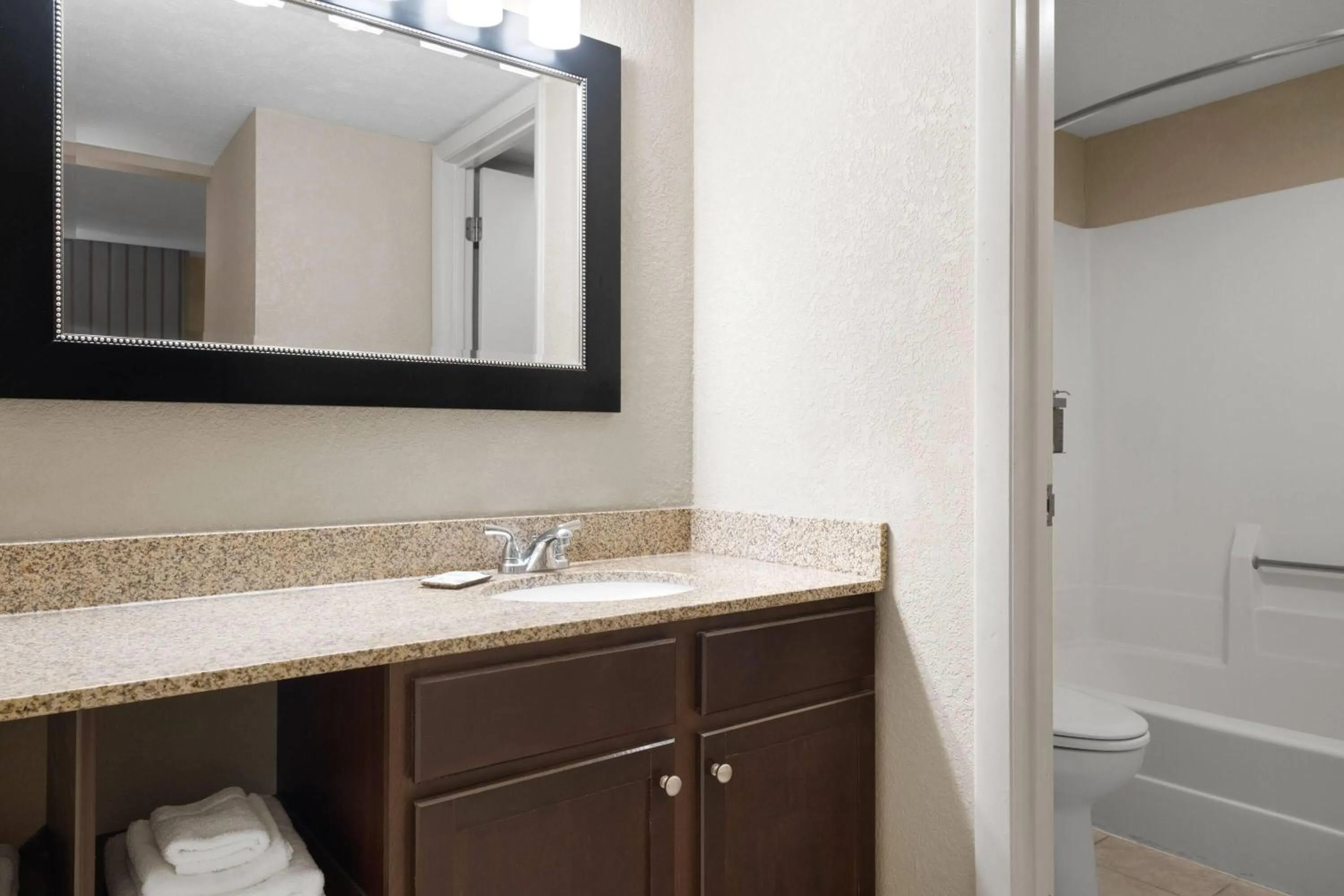 Bathroom in Eastland Suites Hotel & Conference Ctr, Trademark by Wyndham