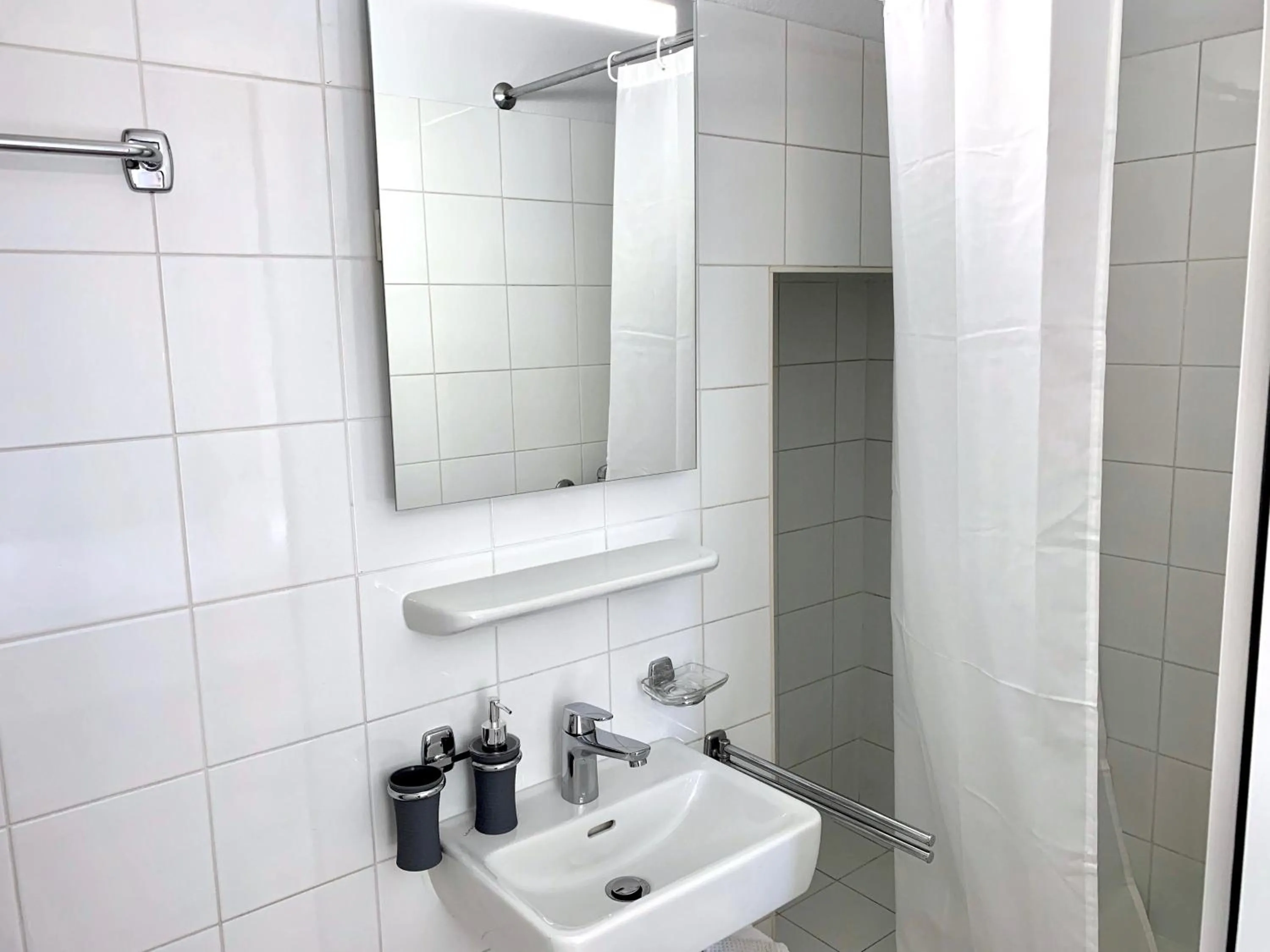 Bathroom in Great2Stay City Center Apartments Locarno