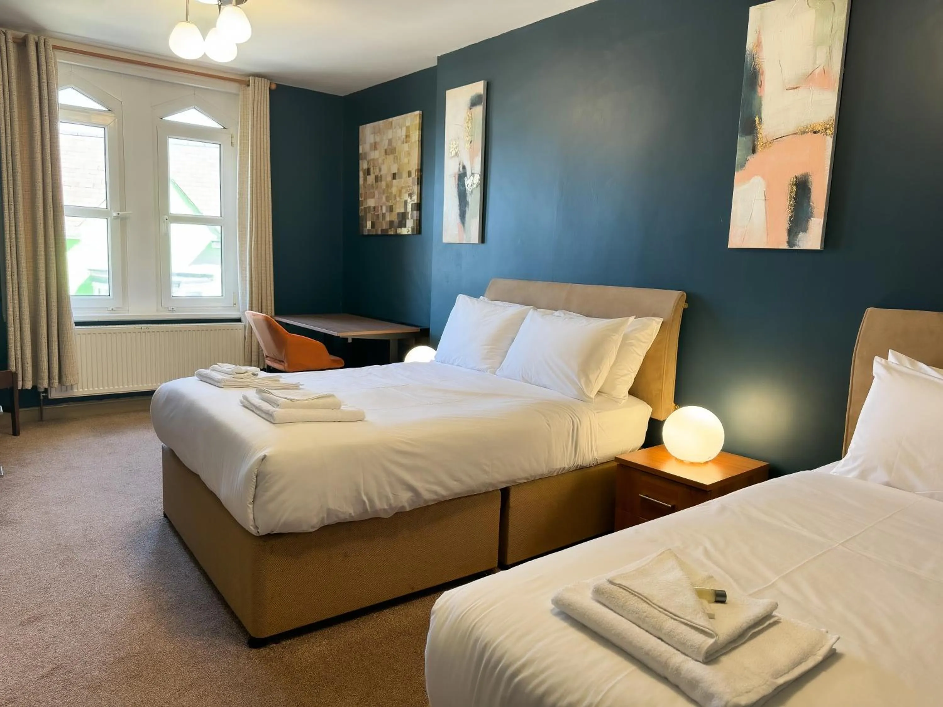 Bed in Nomi Rooms & Restaurant