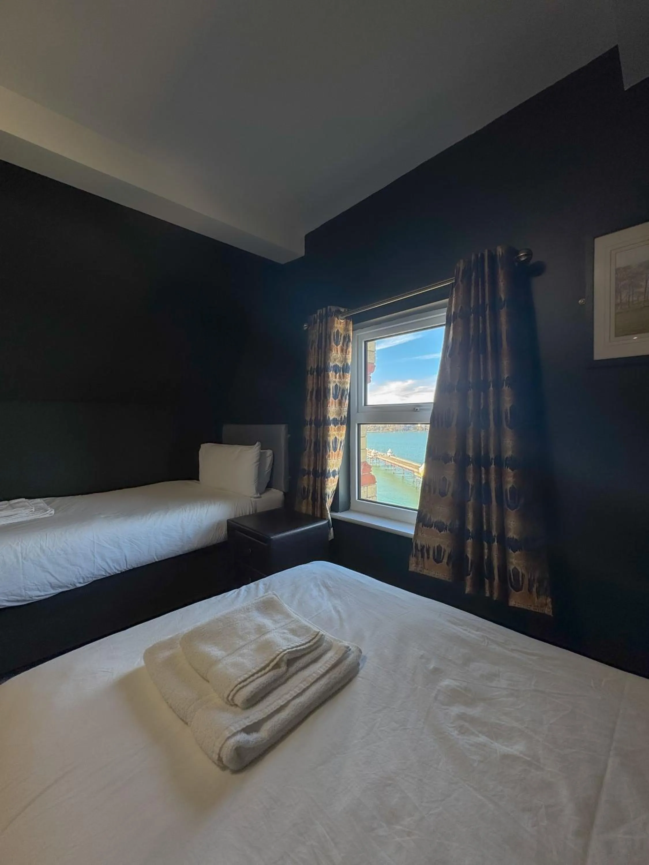 Bed in Nomi Rooms & Restaurant