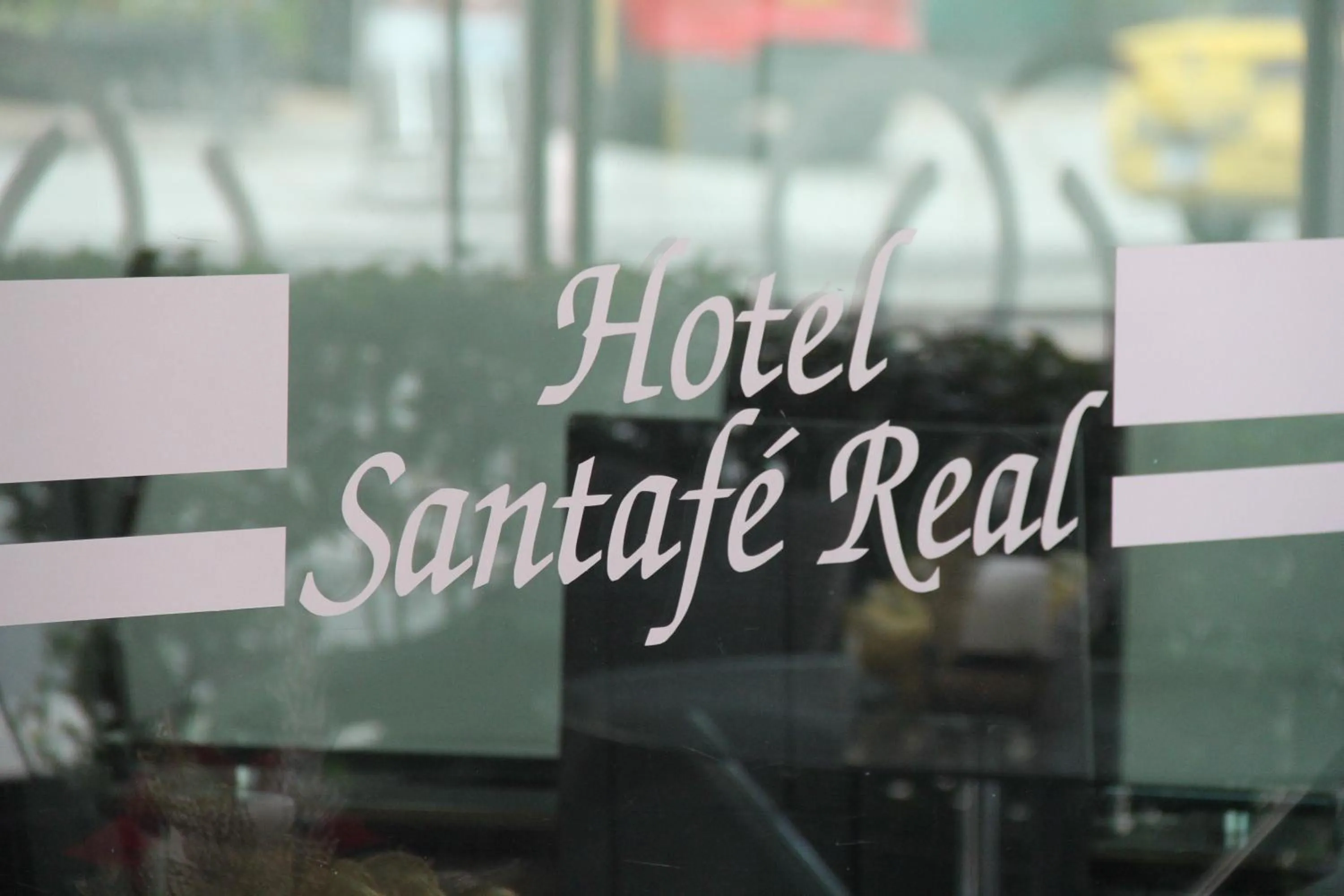 Property logo or sign in Hotel Santafe Real