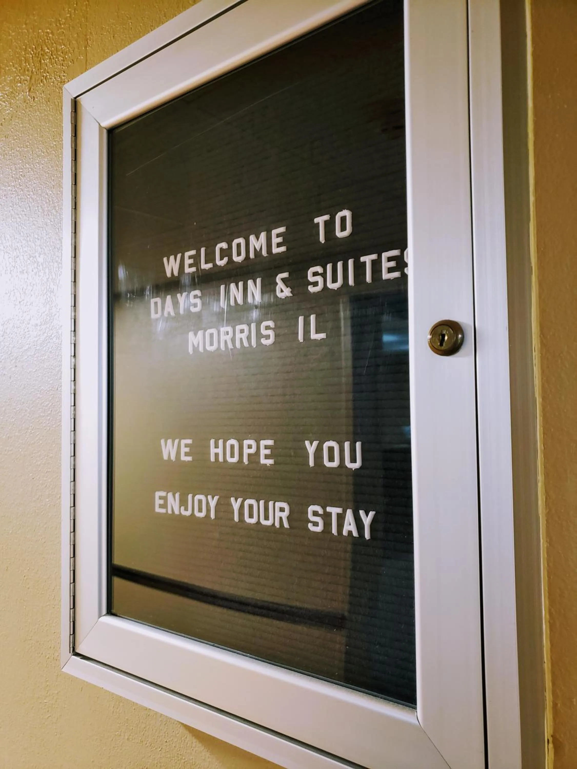 Property logo or sign in Days Inn & Suites by Wyndham Morris I-80