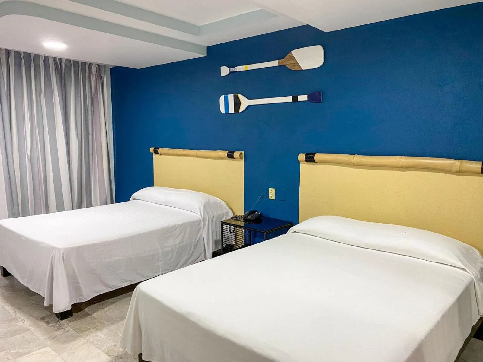 Bed in Acamar Beach Resort