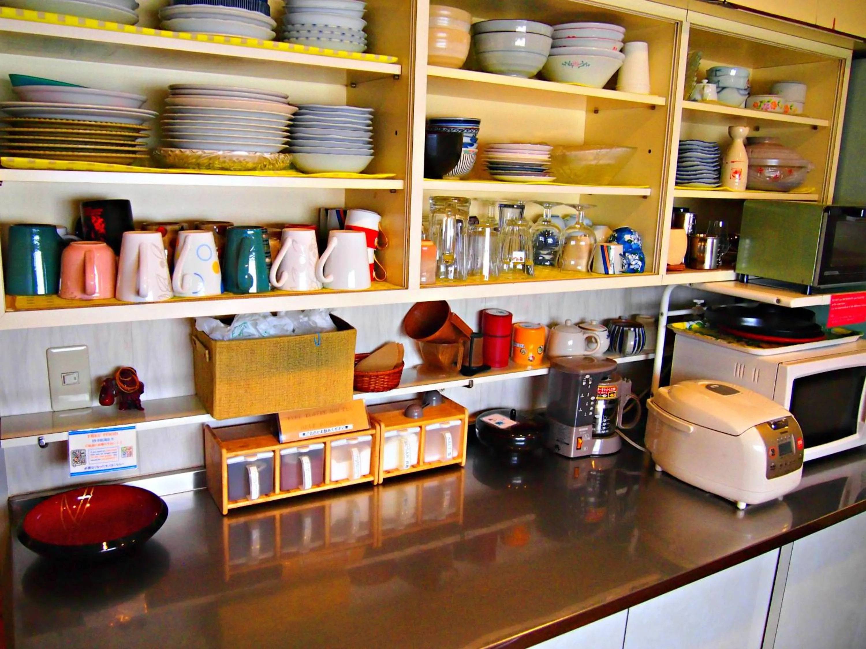 Kitchen or kitchenette in J-Hoppers Hiroshima Guesthouse