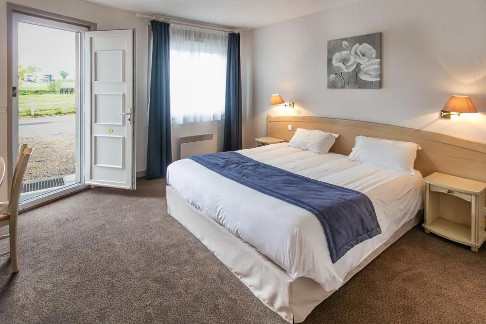 Bed in Le Charollais Motel Contact-Hôtel