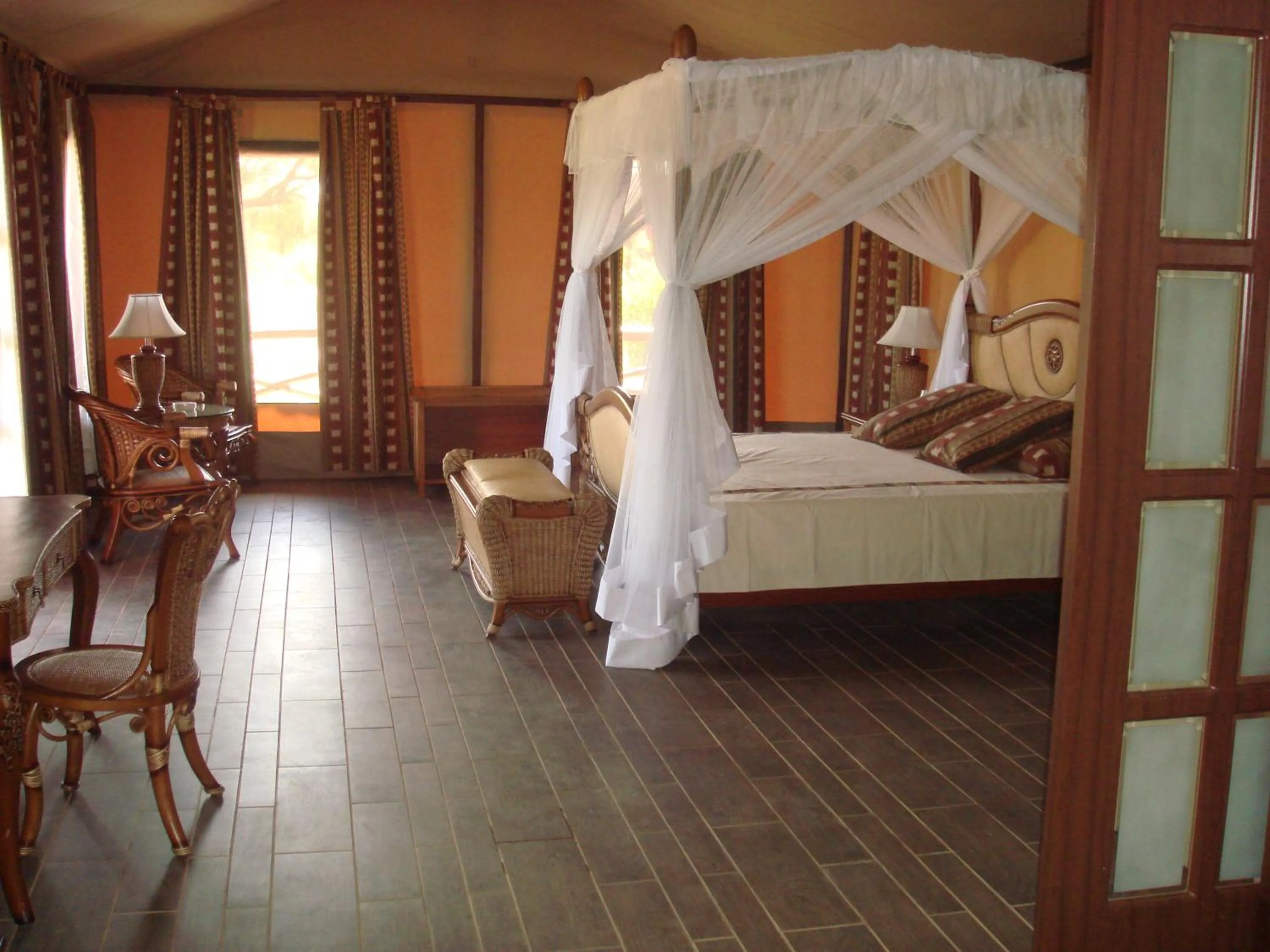 Bed in Kilima Safari Camp