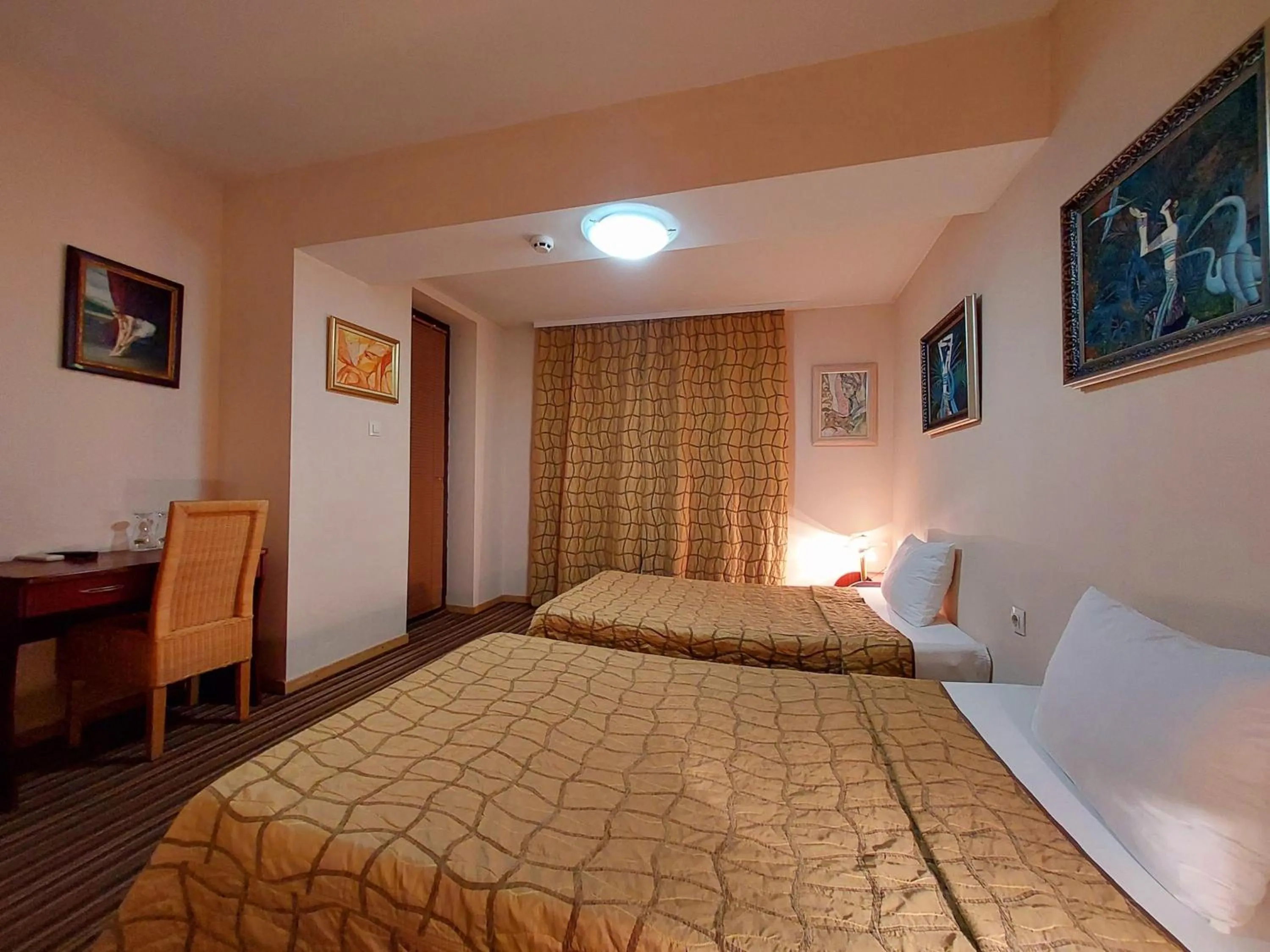 Bed in Family Art Hotel Gallery