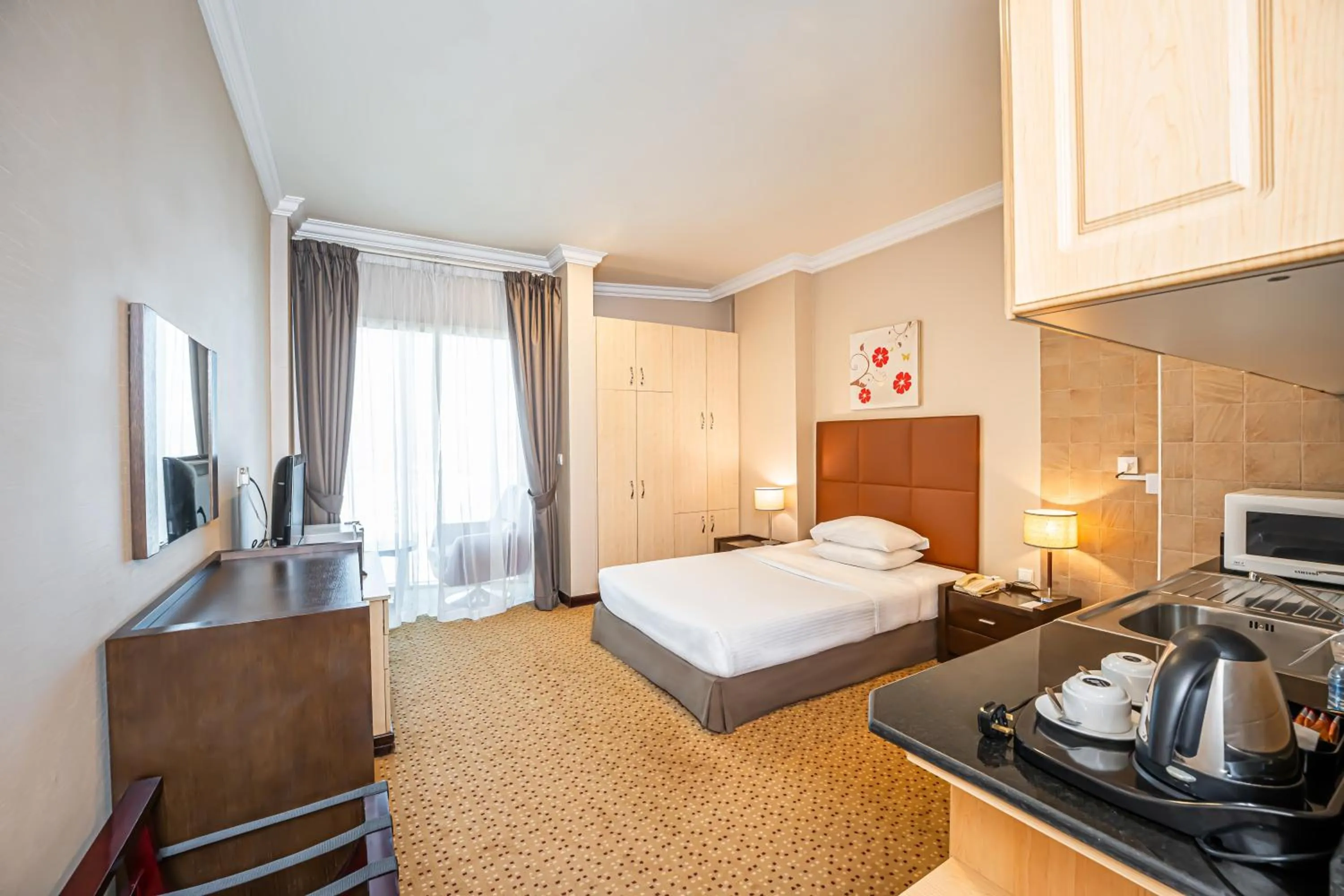 Bed in Kingsgate Hotel Doha by Millennium Hotels