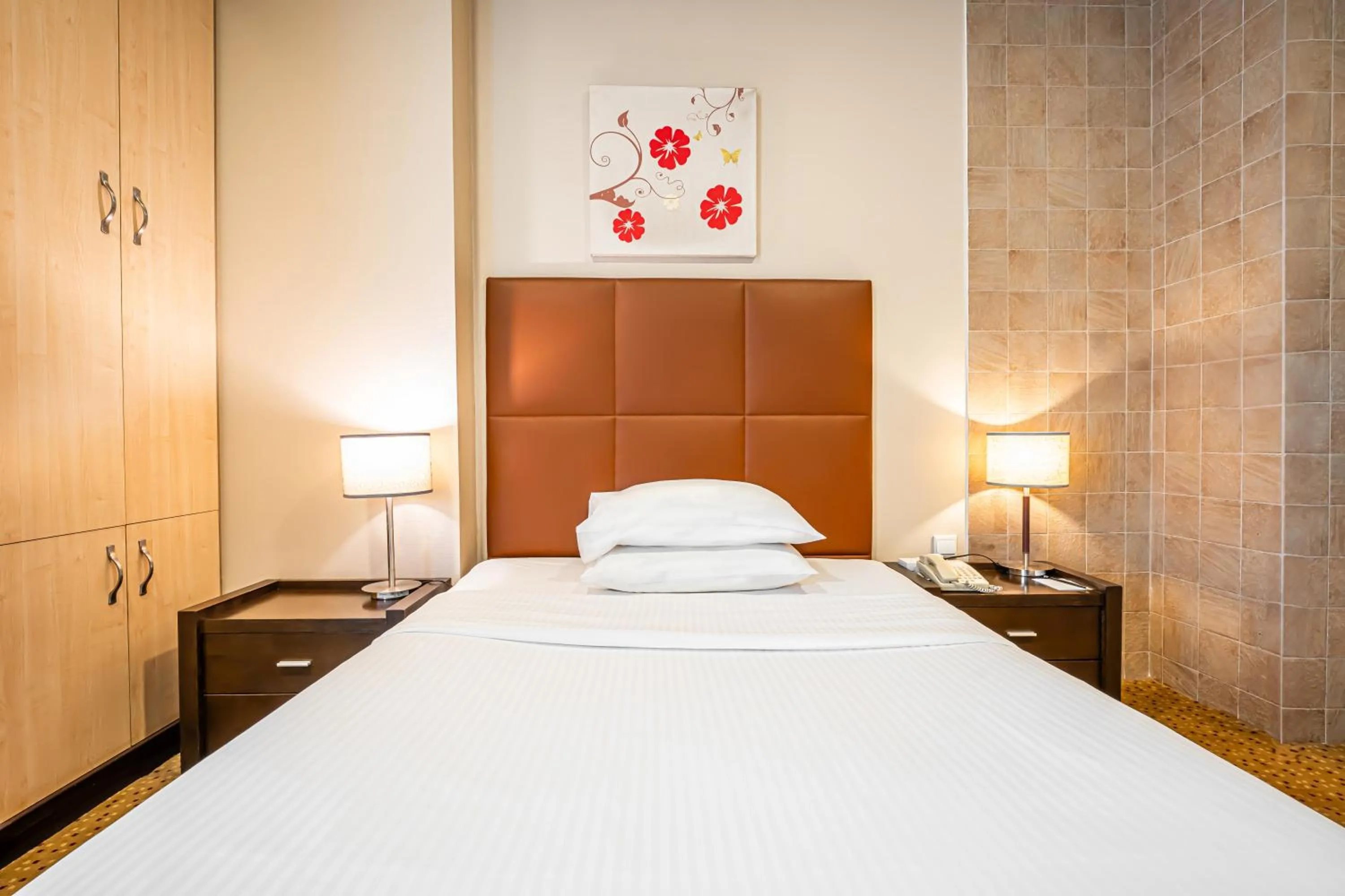 Bed in Kingsgate Hotel Doha by Millennium Hotels