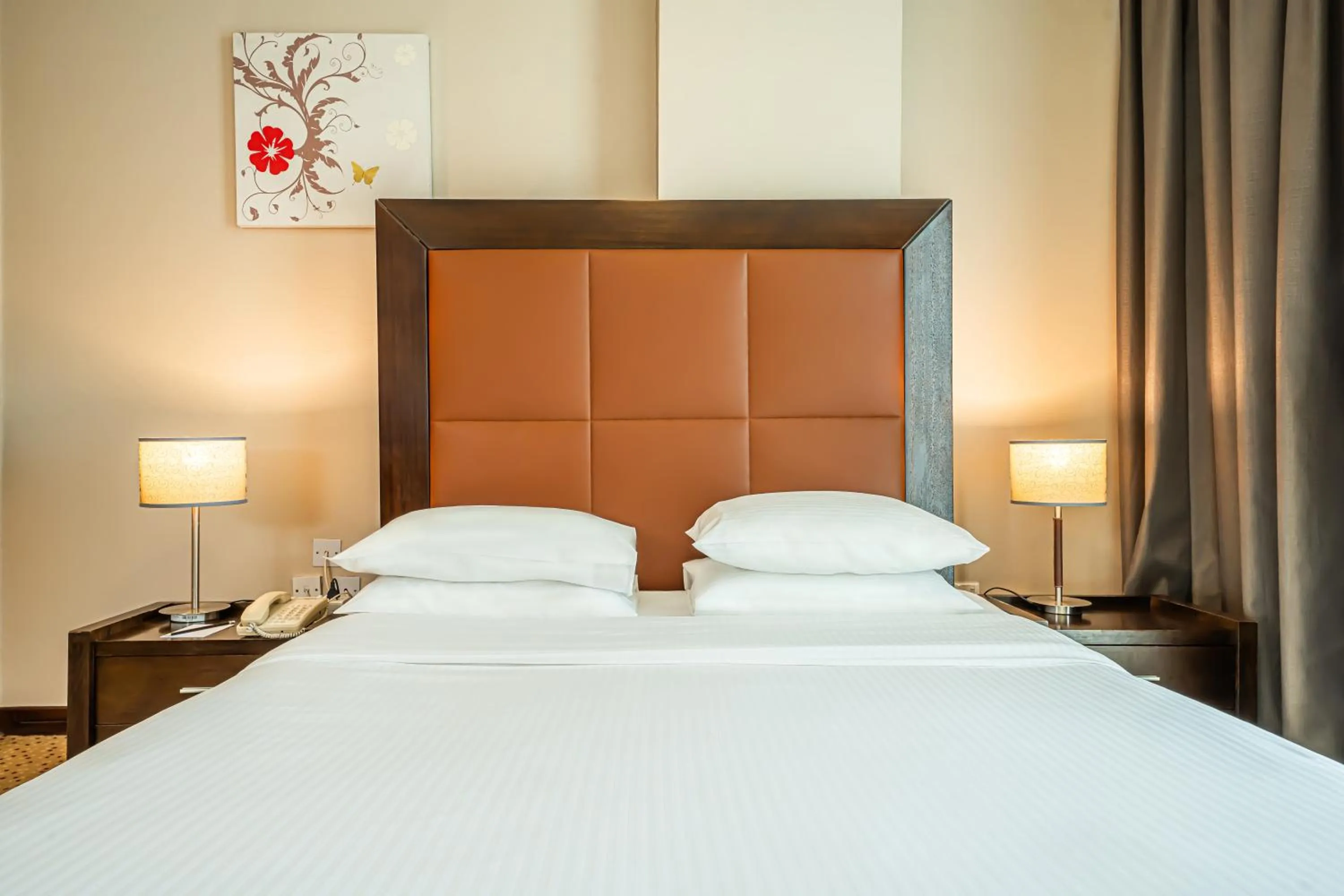 Bed in Kingsgate Hotel Doha by Millennium Hotels