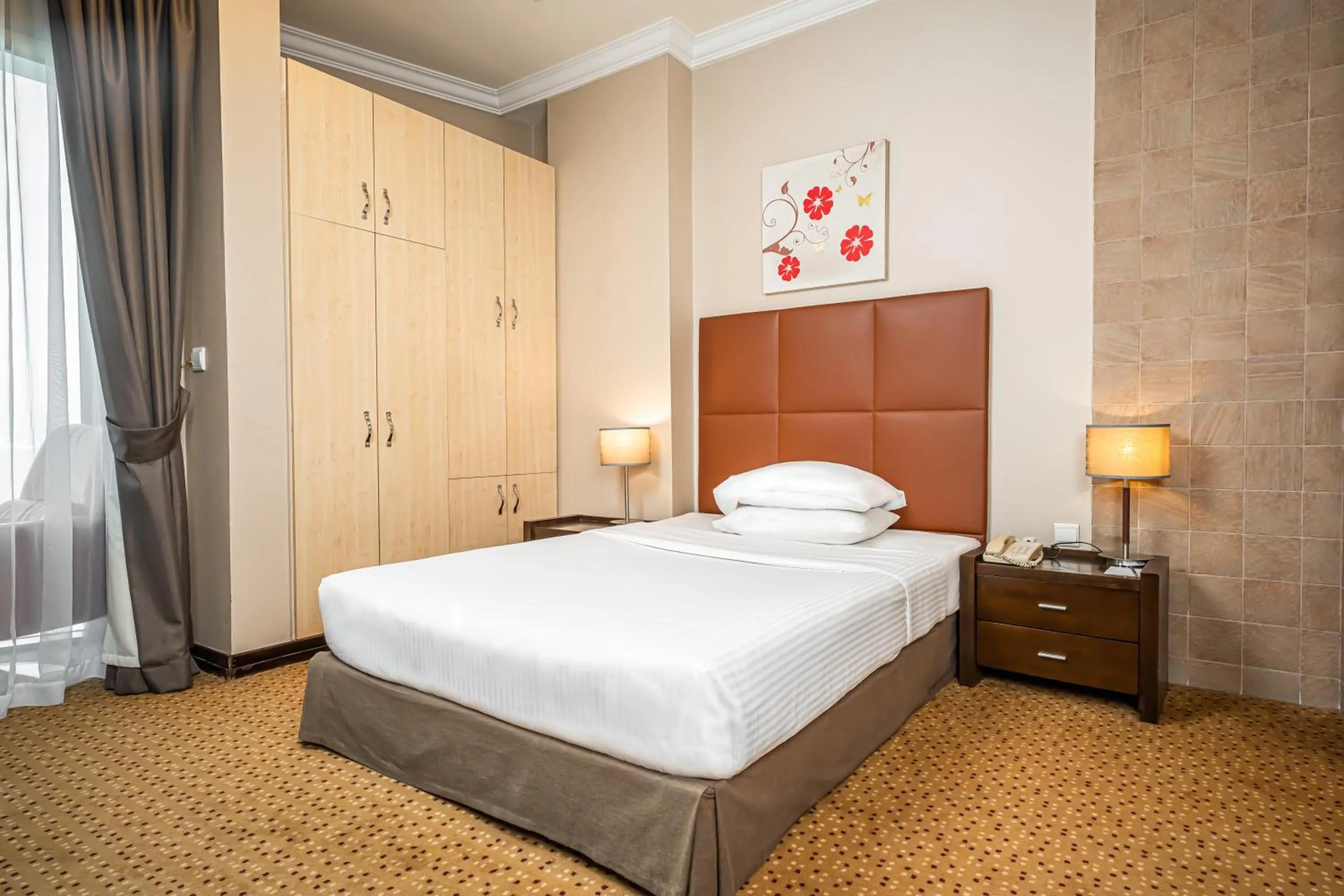 Bed in Kingsgate Hotel Doha by Millennium Hotels