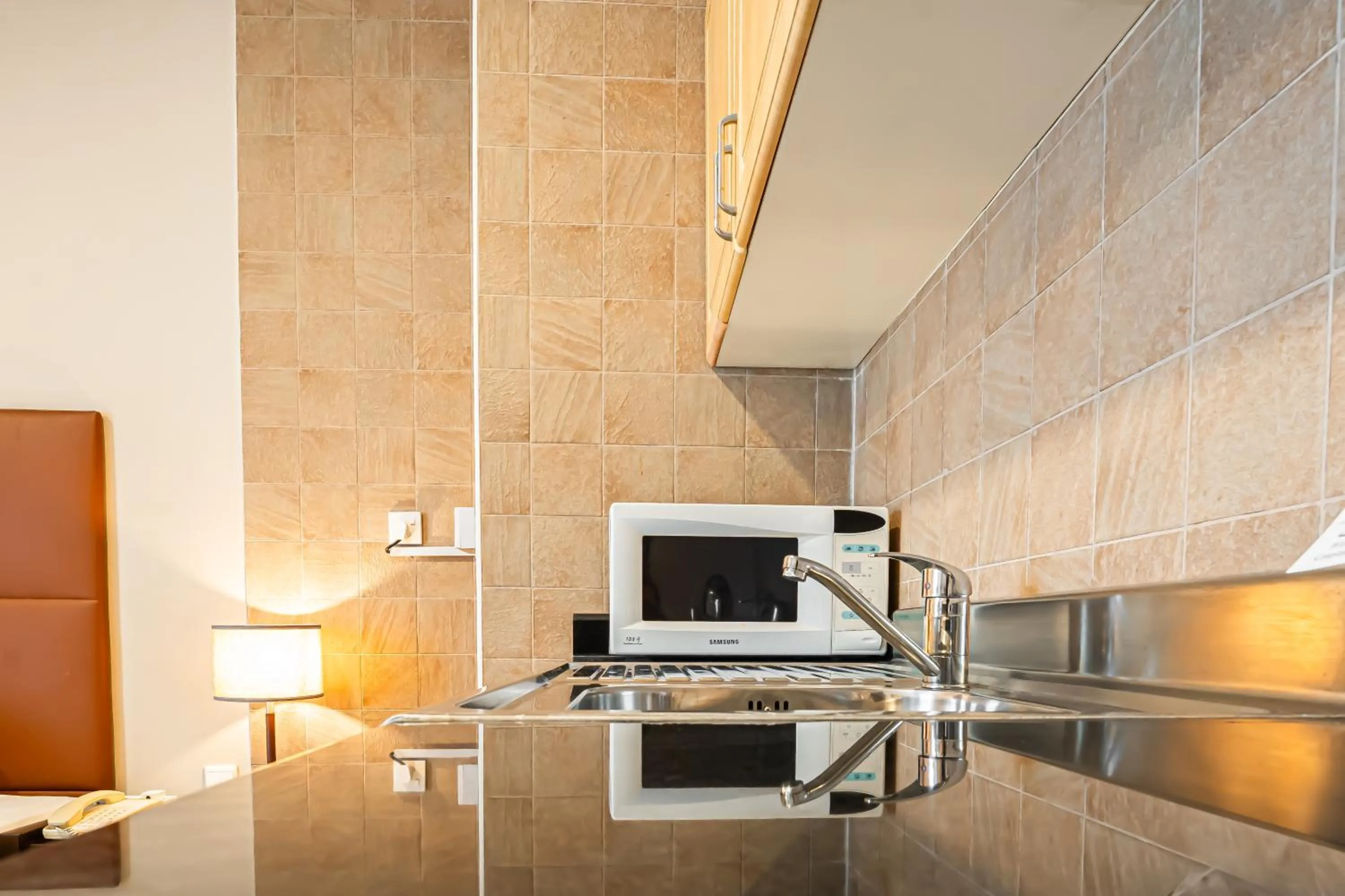 Kitchen or kitchenette in Kingsgate Hotel Doha by Millennium Hotels