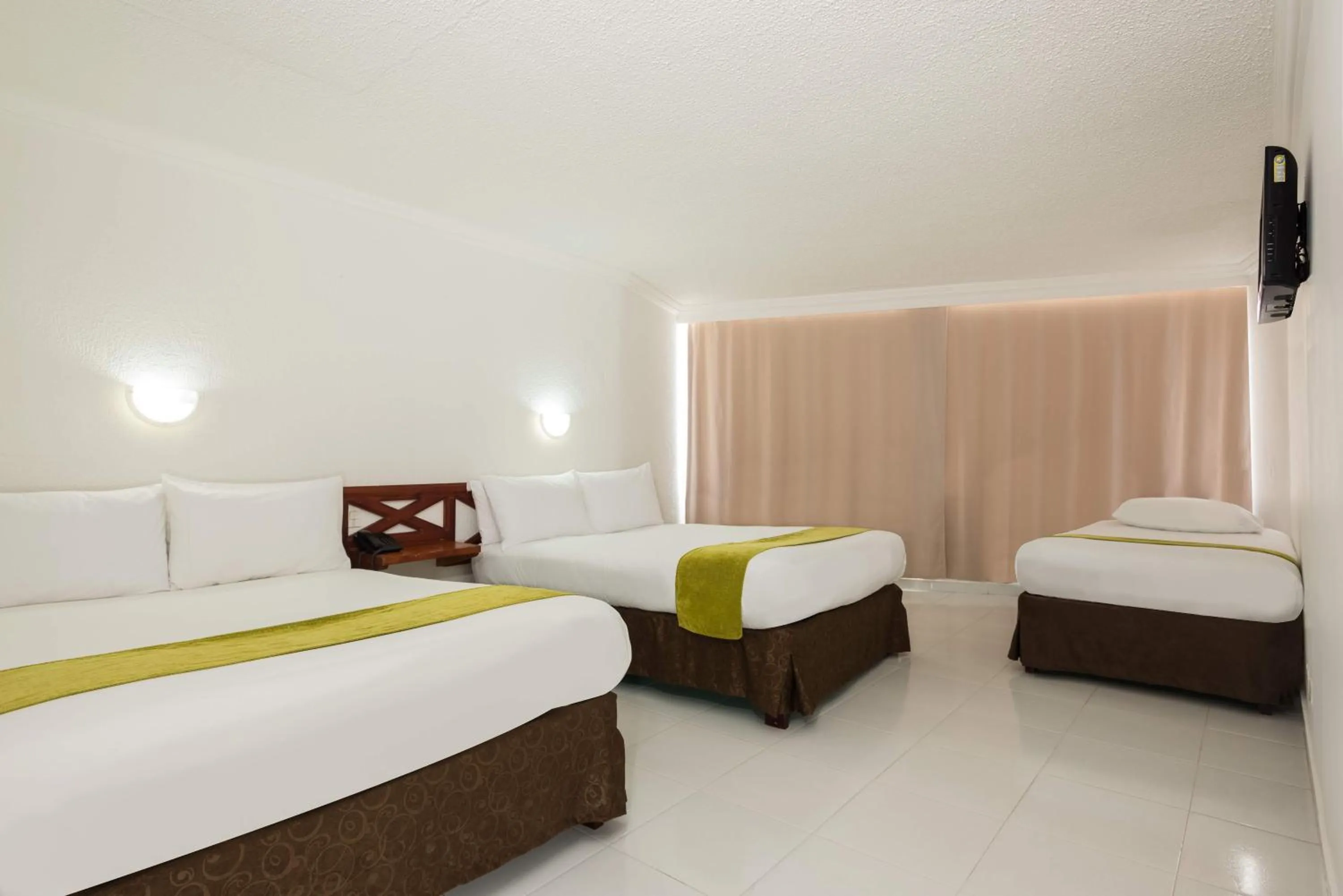 Bed in Calypso Beach Hotel