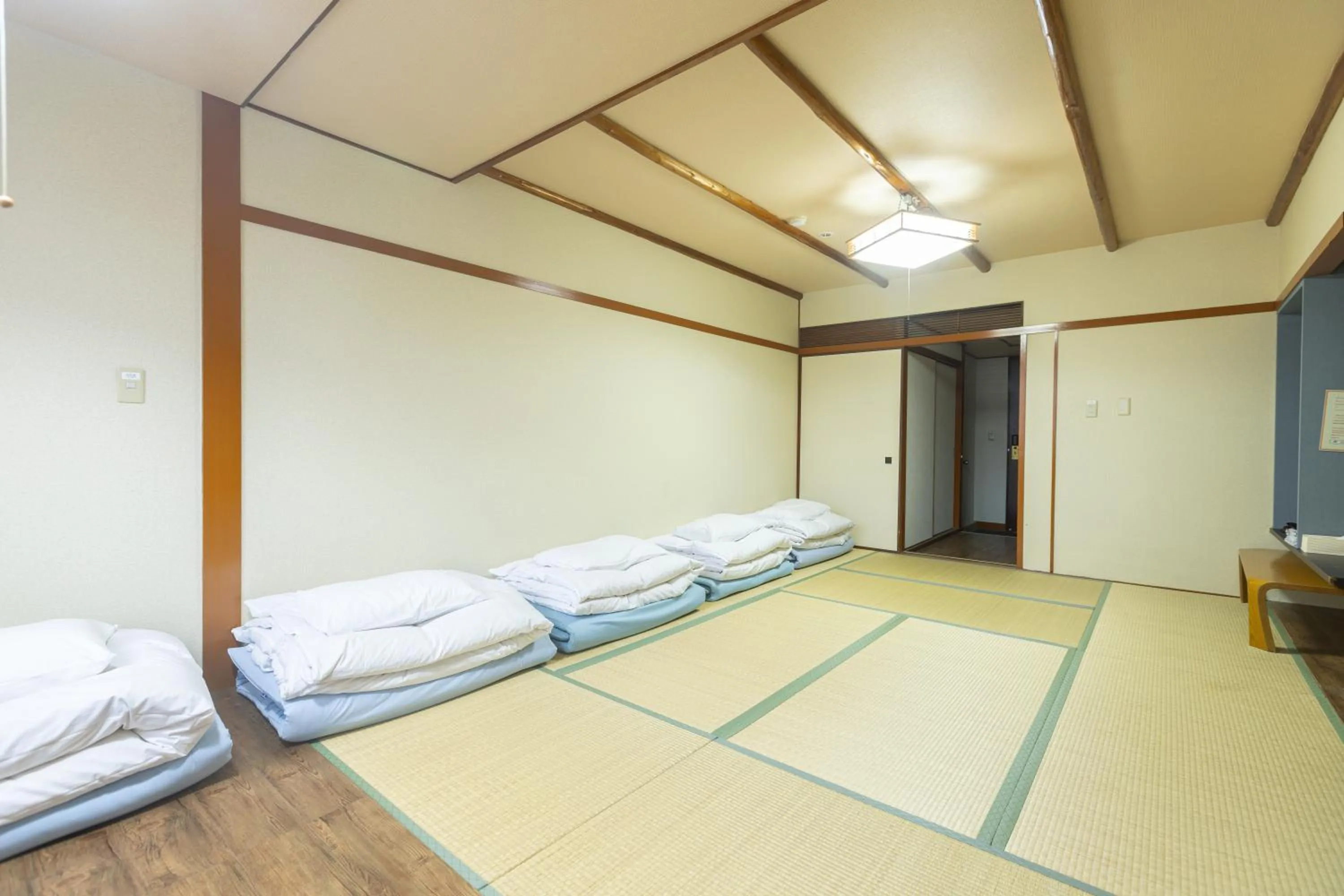 Bed in Hotel Naniwa