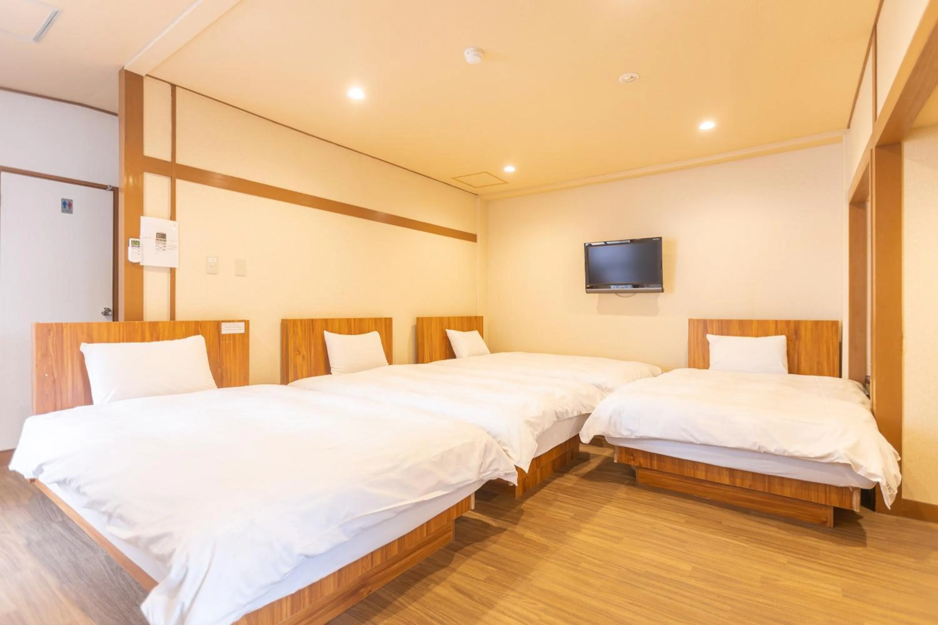 Bed in Hotel Naniwa