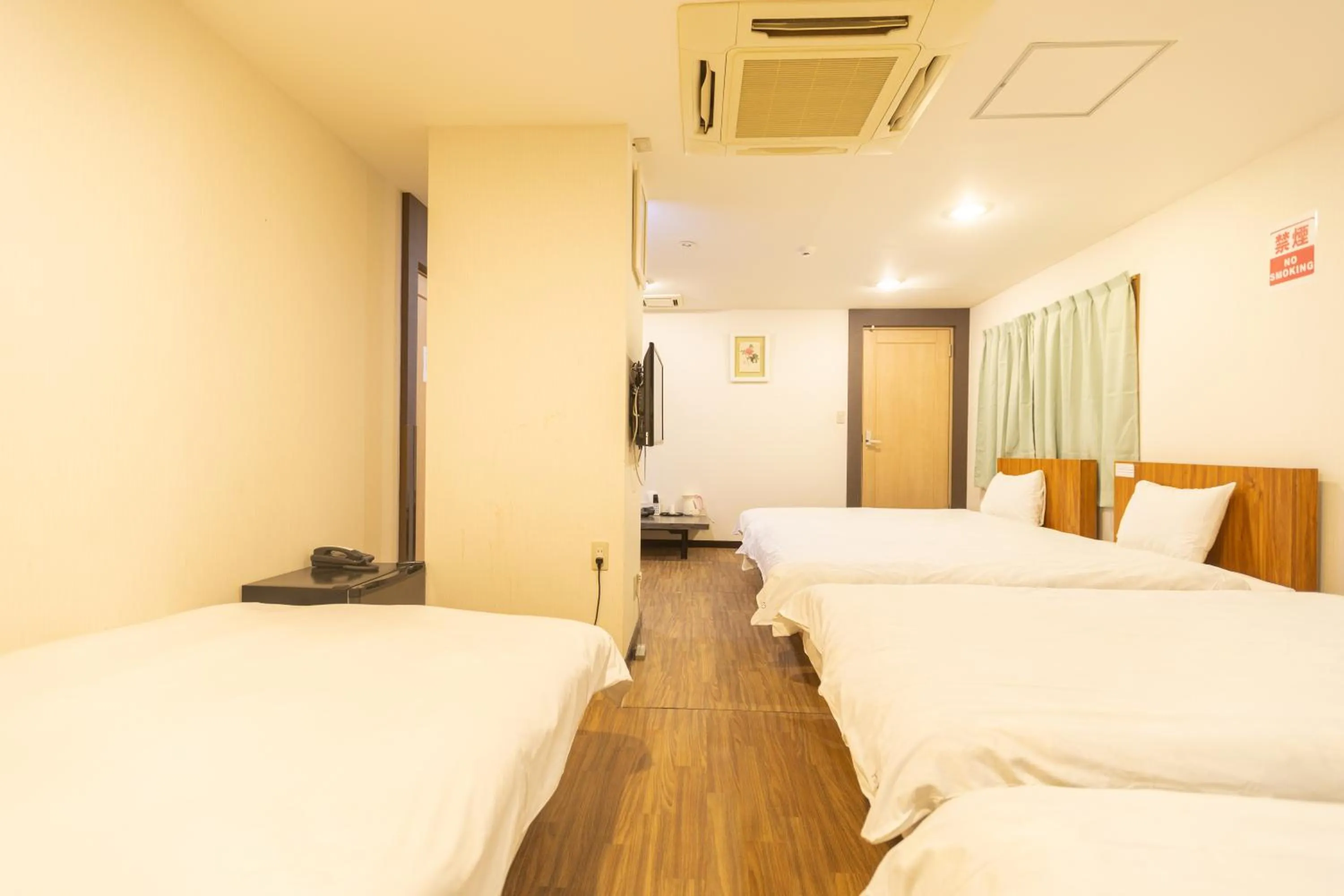 Bed in Hotel Naniwa
