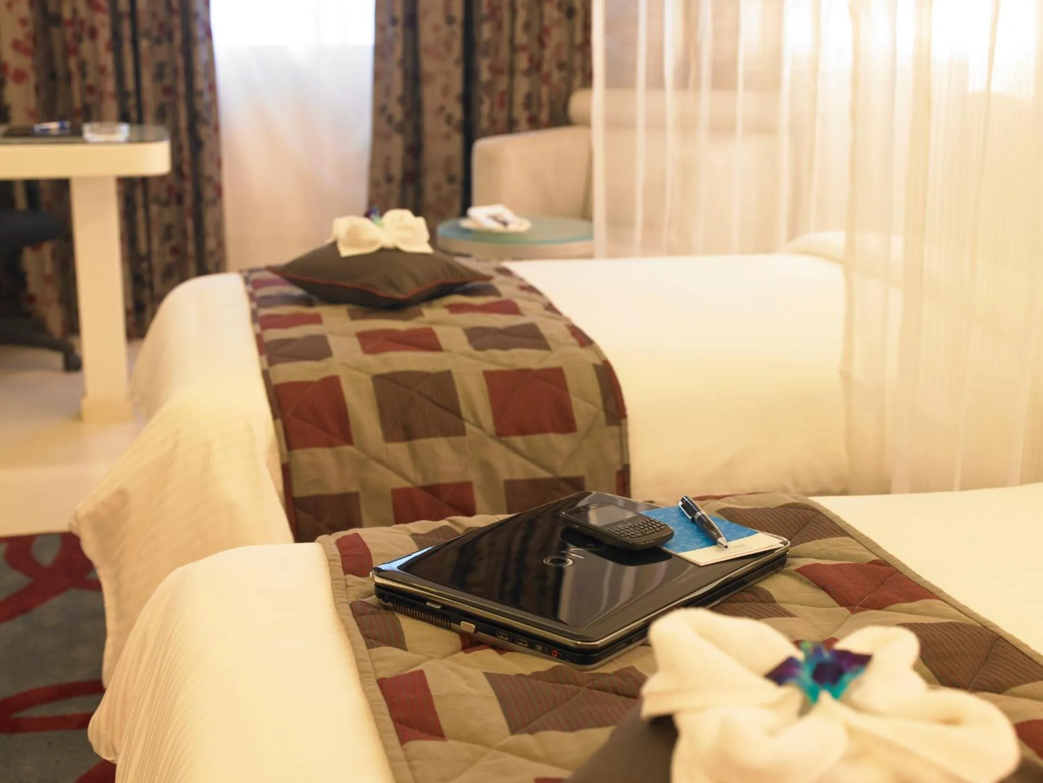 Bed in Blu Petal - A Business Hotel