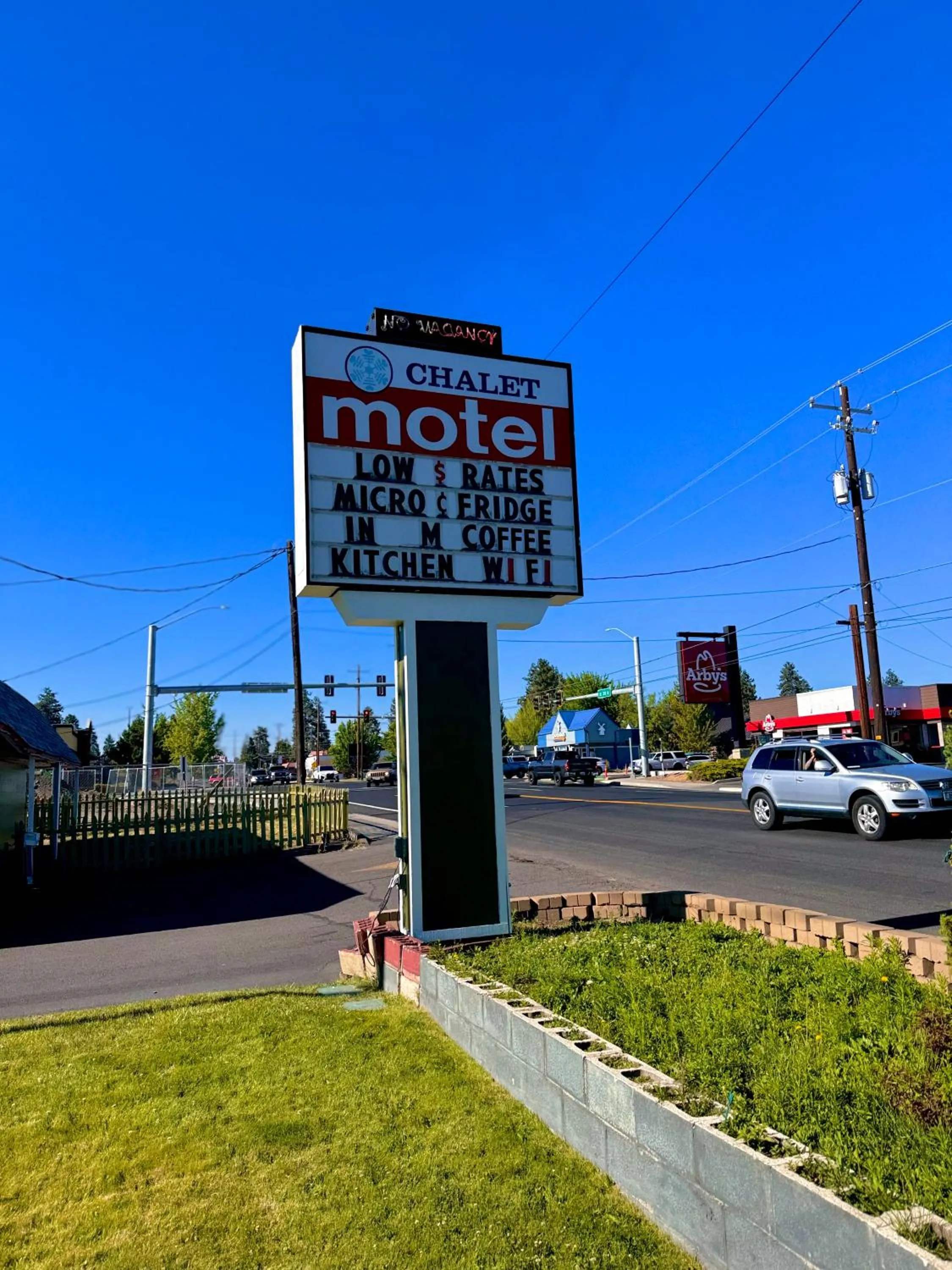 Property logo or sign in Chalet Motel - Affordable Stay in Central Bend