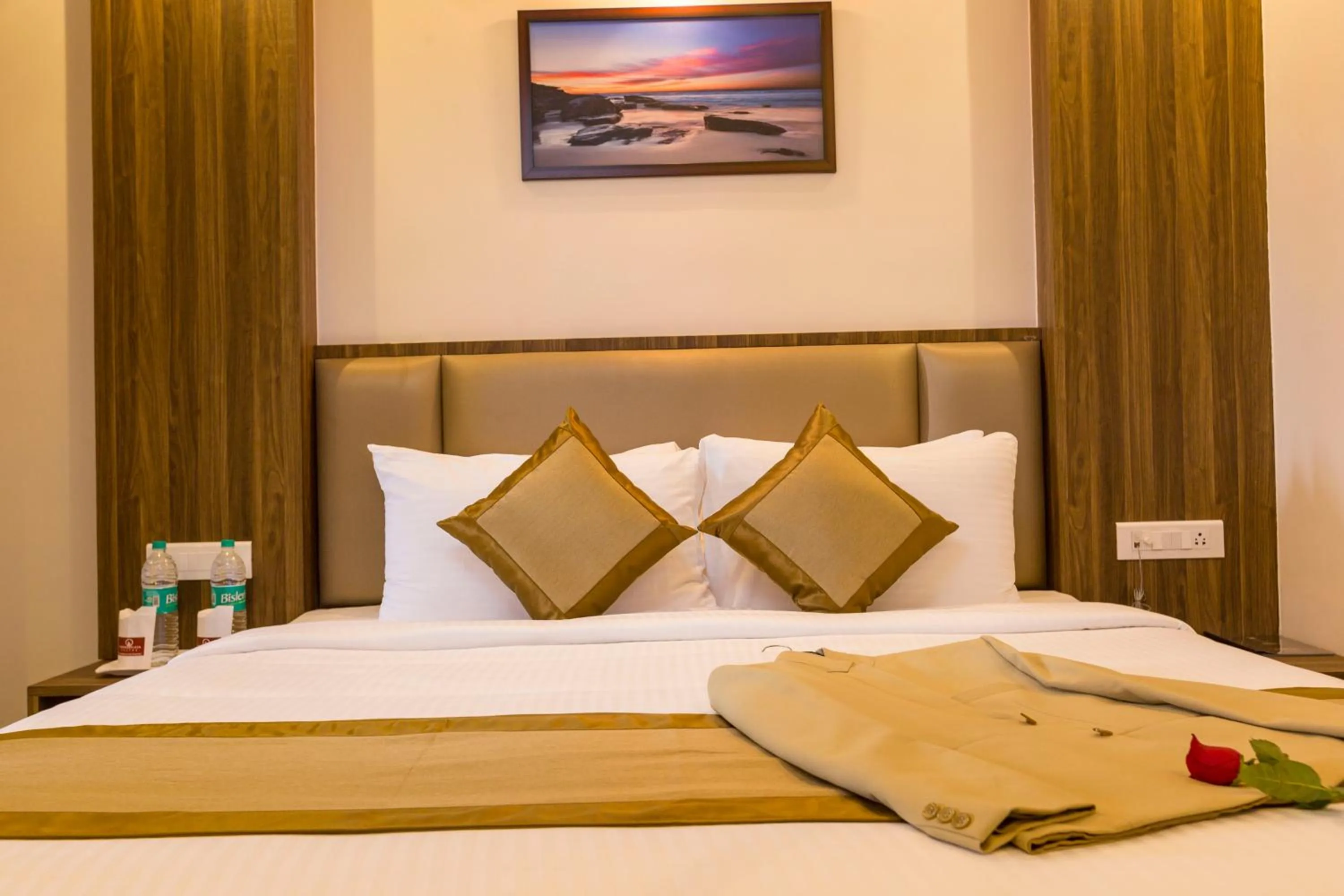 Bed in Grand Plaza Suites