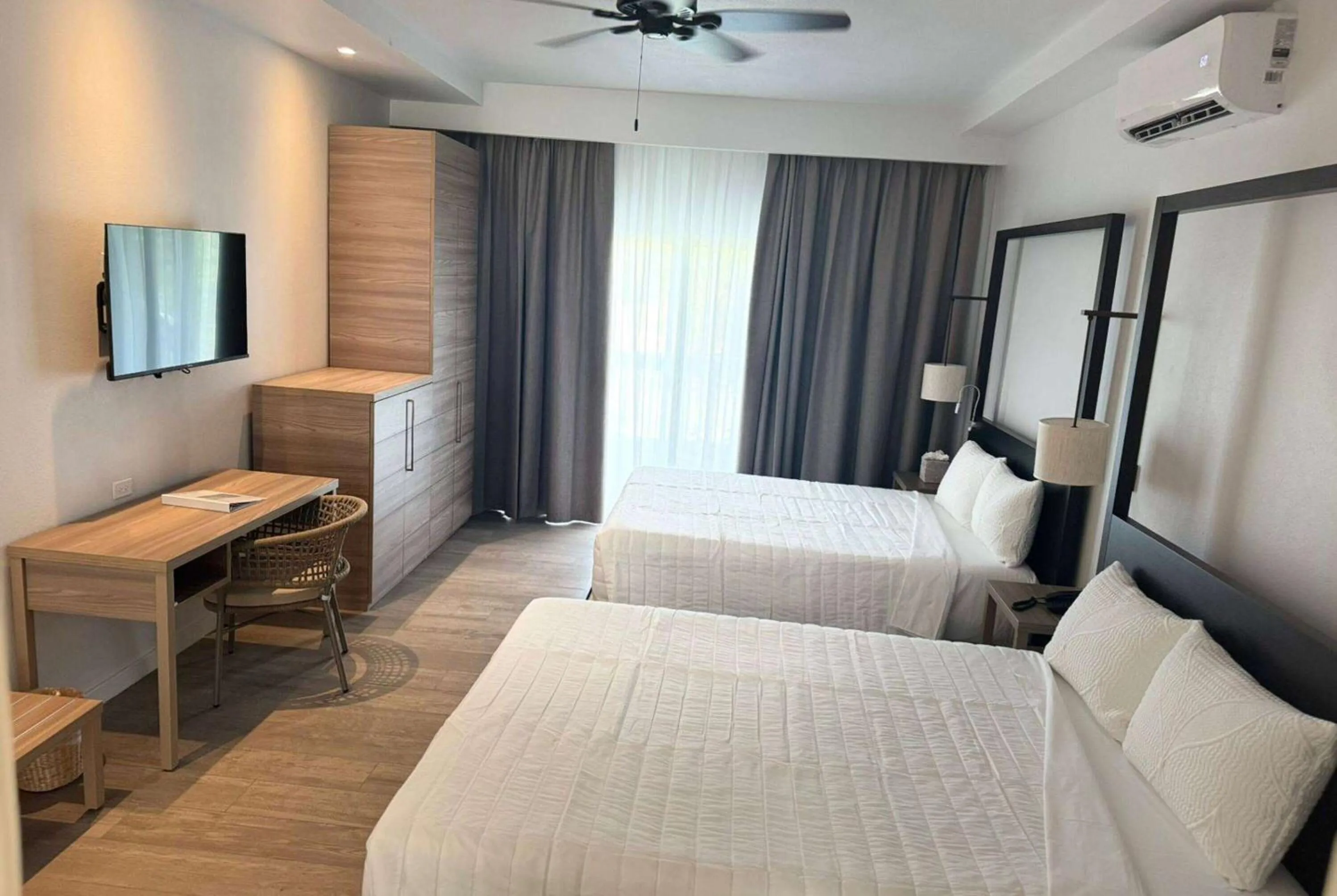 Photo of the whole room, Bed in Wyndham Tortola BVI Lambert Beach Resort