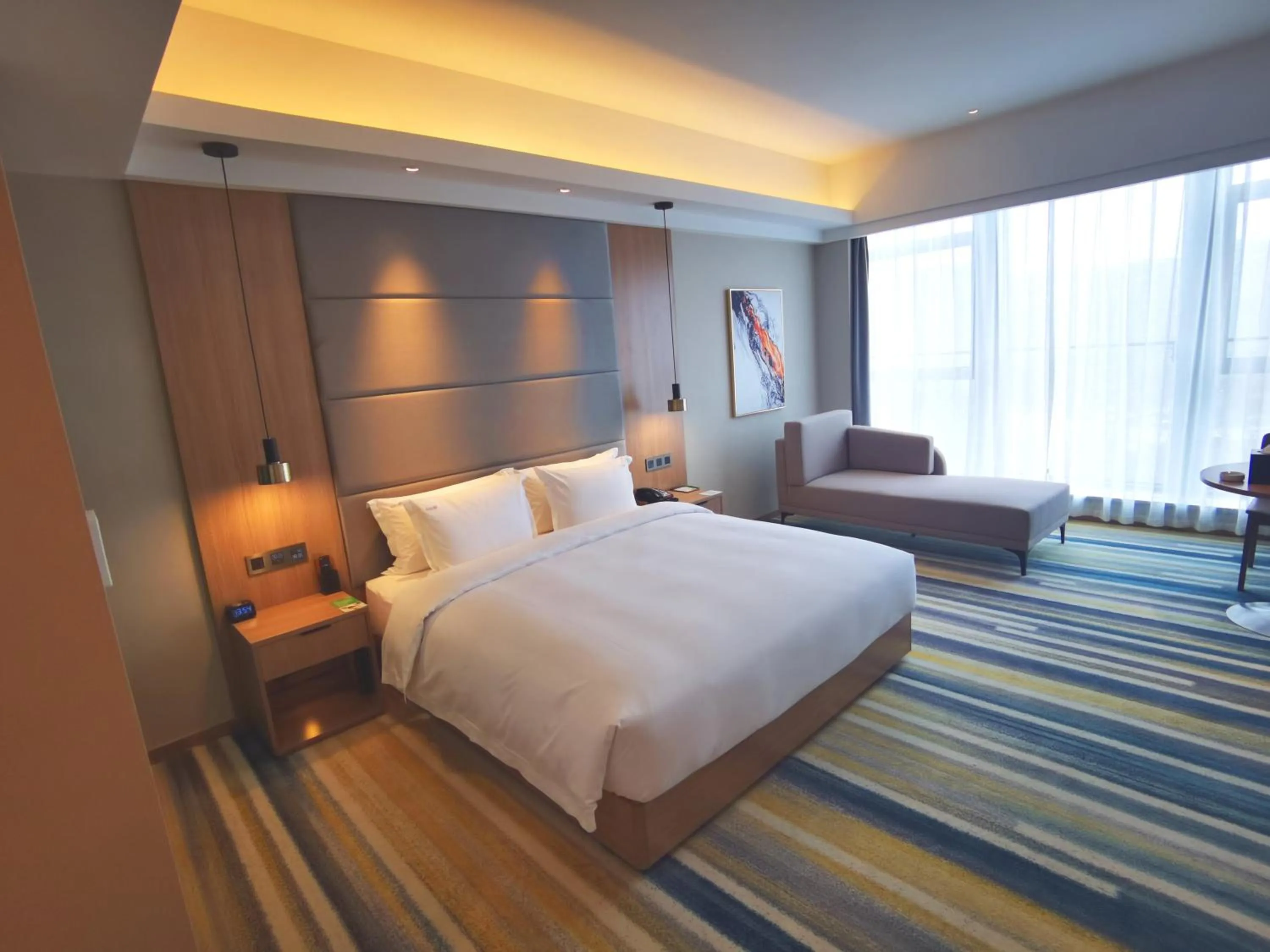 Photo of the whole room, Bed in Holiday Inn Nantong Oasis International by IHG