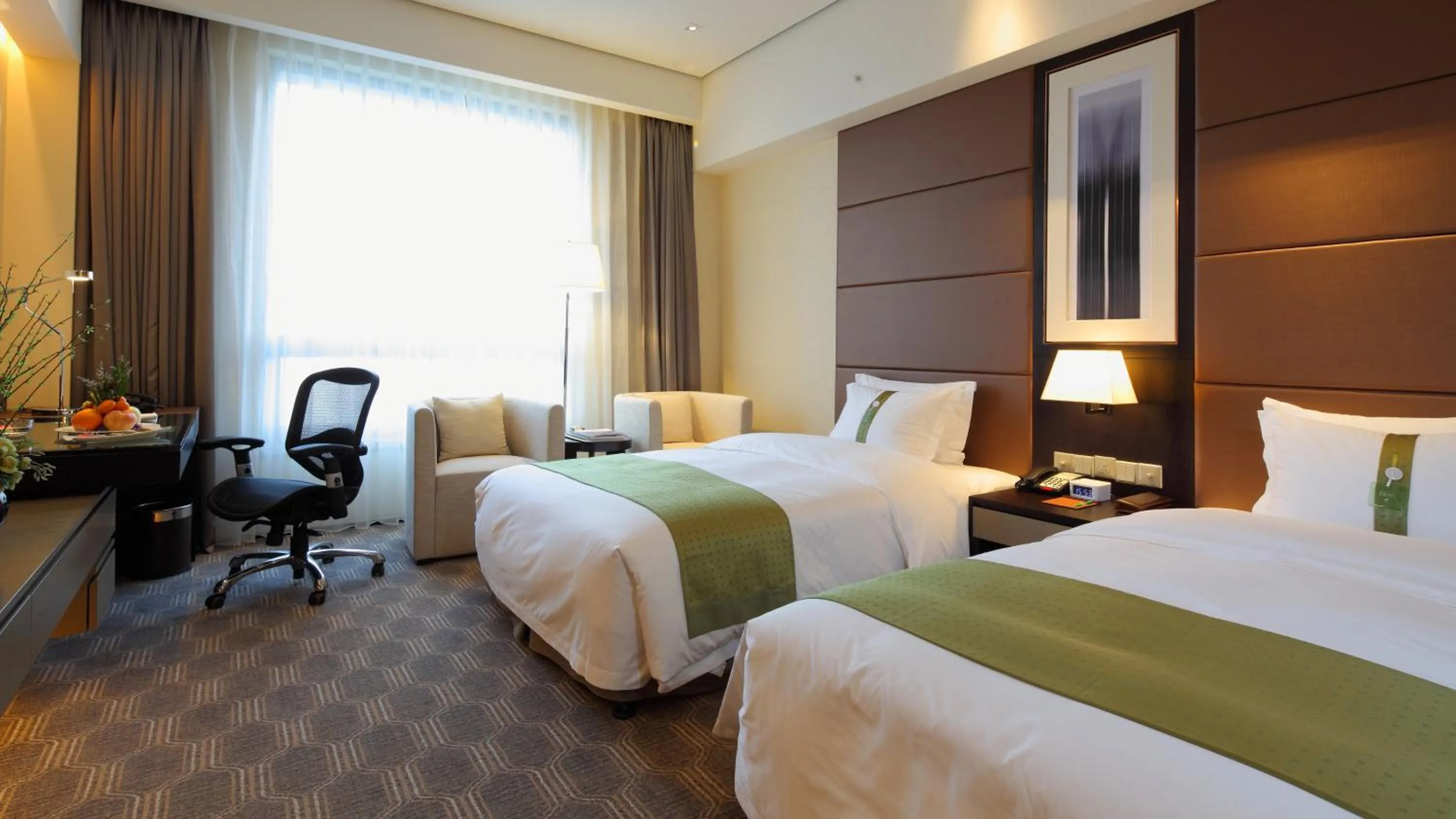 Photo of the whole room, Bed in Holiday Inn Nantong Oasis International by IHG