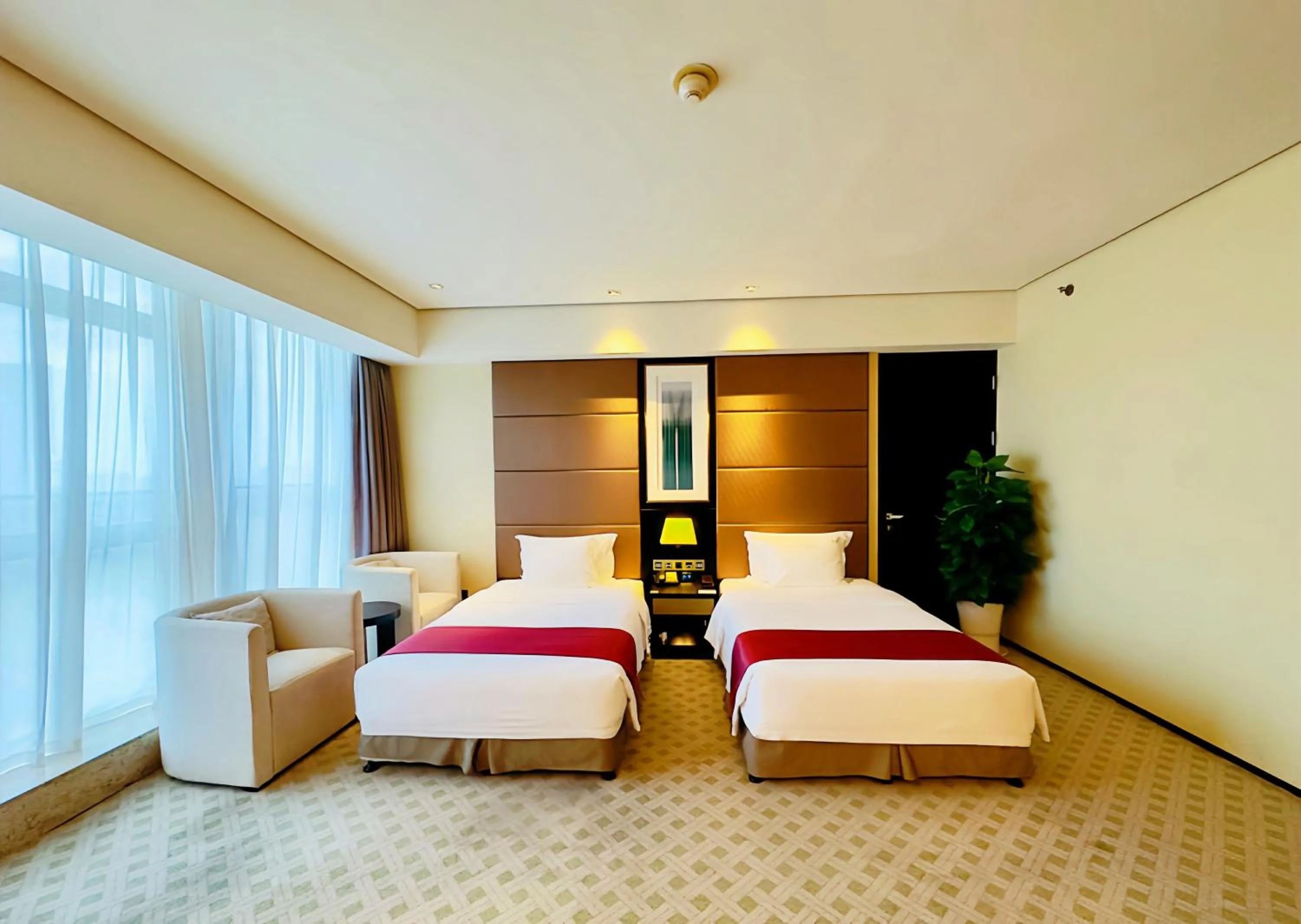 Bed in Holiday Inn Nantong Oasis International by IHG