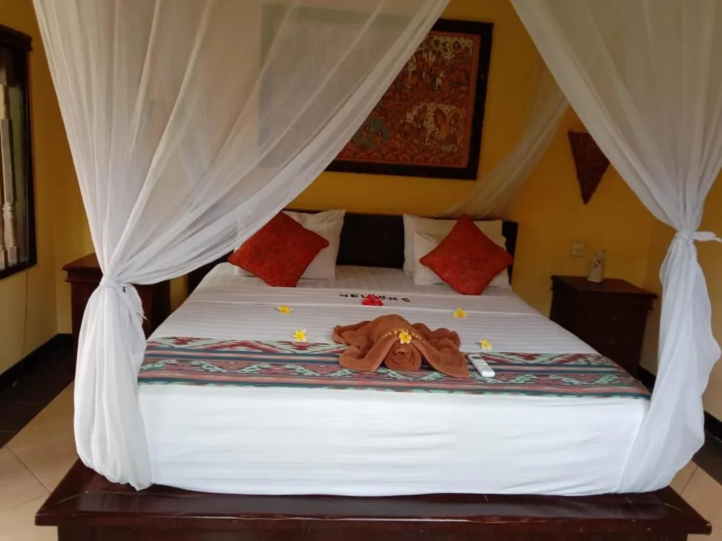 Bed in Tirta Sari Bungalow
