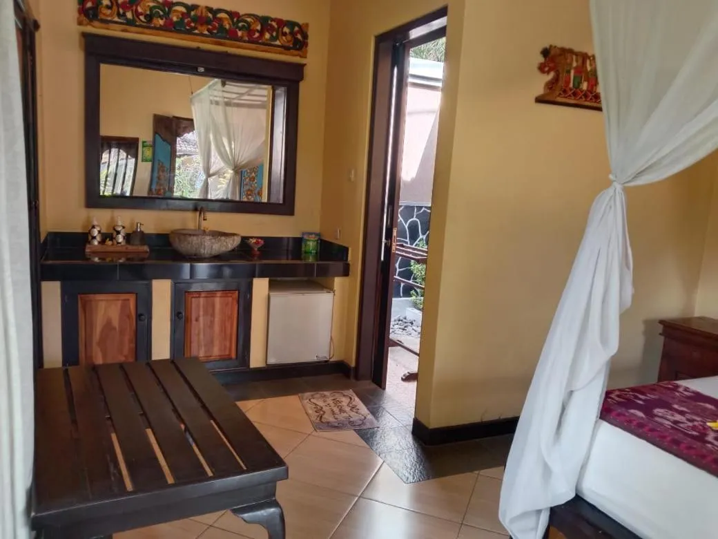 Bed in Tirta Sari Bungalow