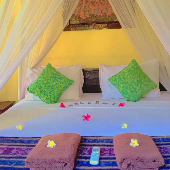 Bed in Tirta Sari Bungalow