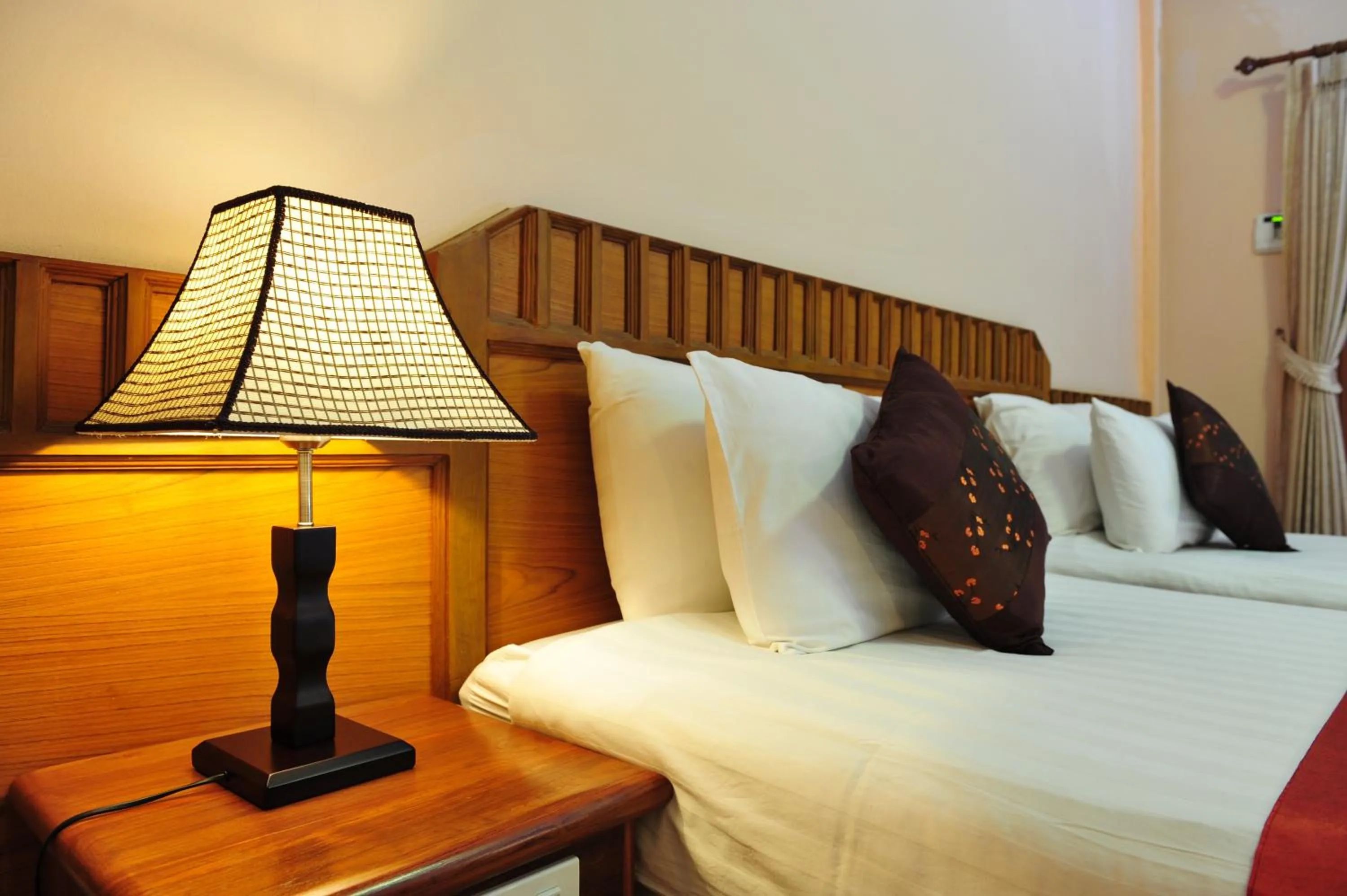 Bed in Baan Kiang Chan Resort