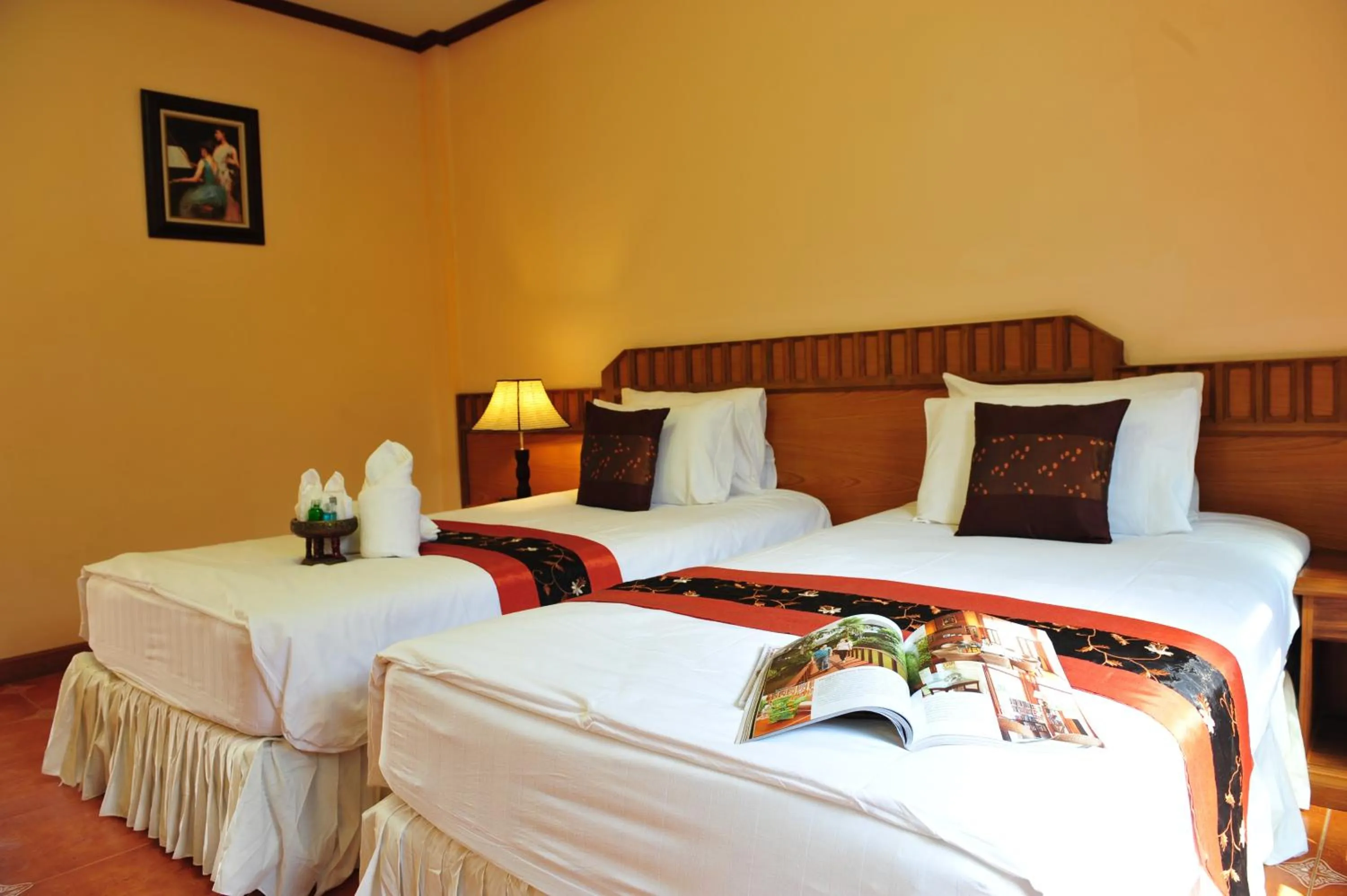 Bed in Baan Kiang Chan Resort