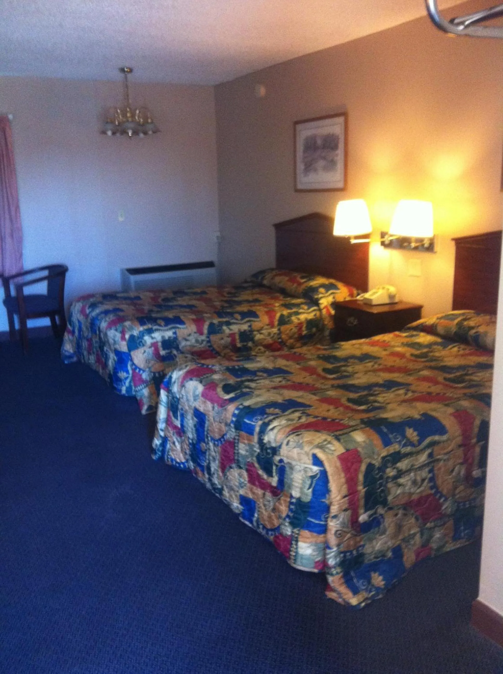 Bed in Red Carpet Inn