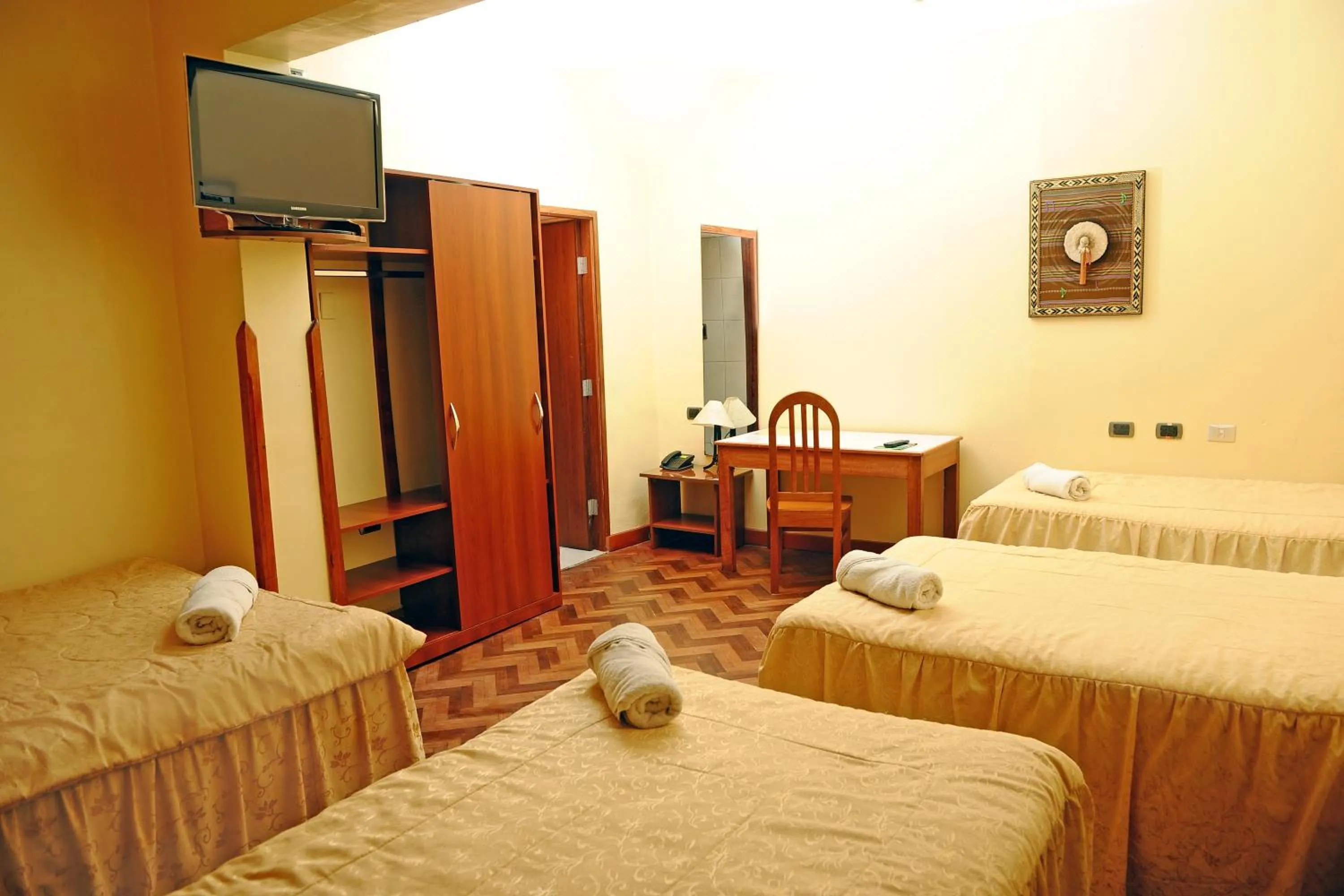 Bed in Hotel Sol del Oriente Cusco