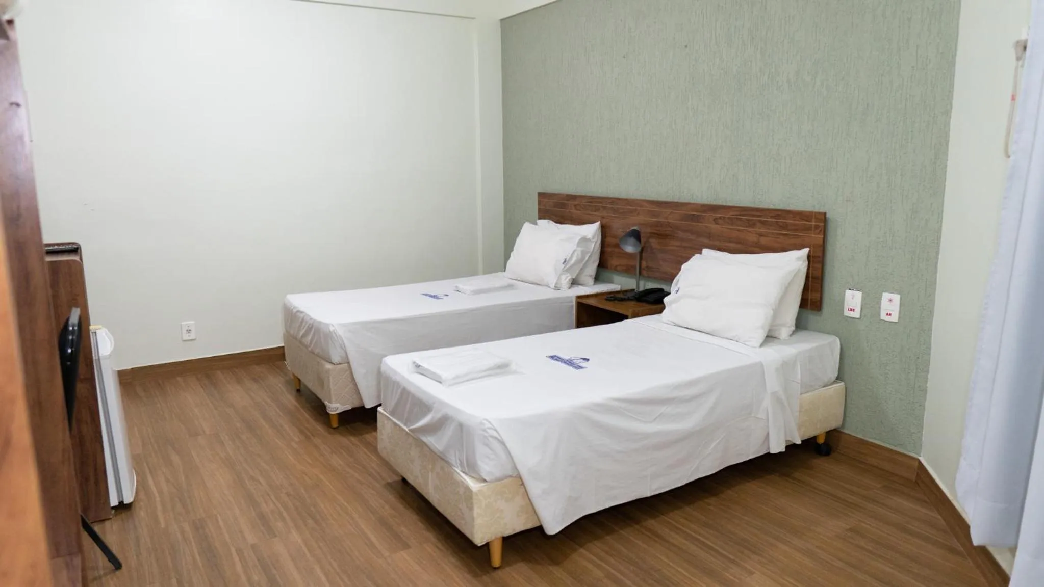 Bed in Nobile Plaza Hotel