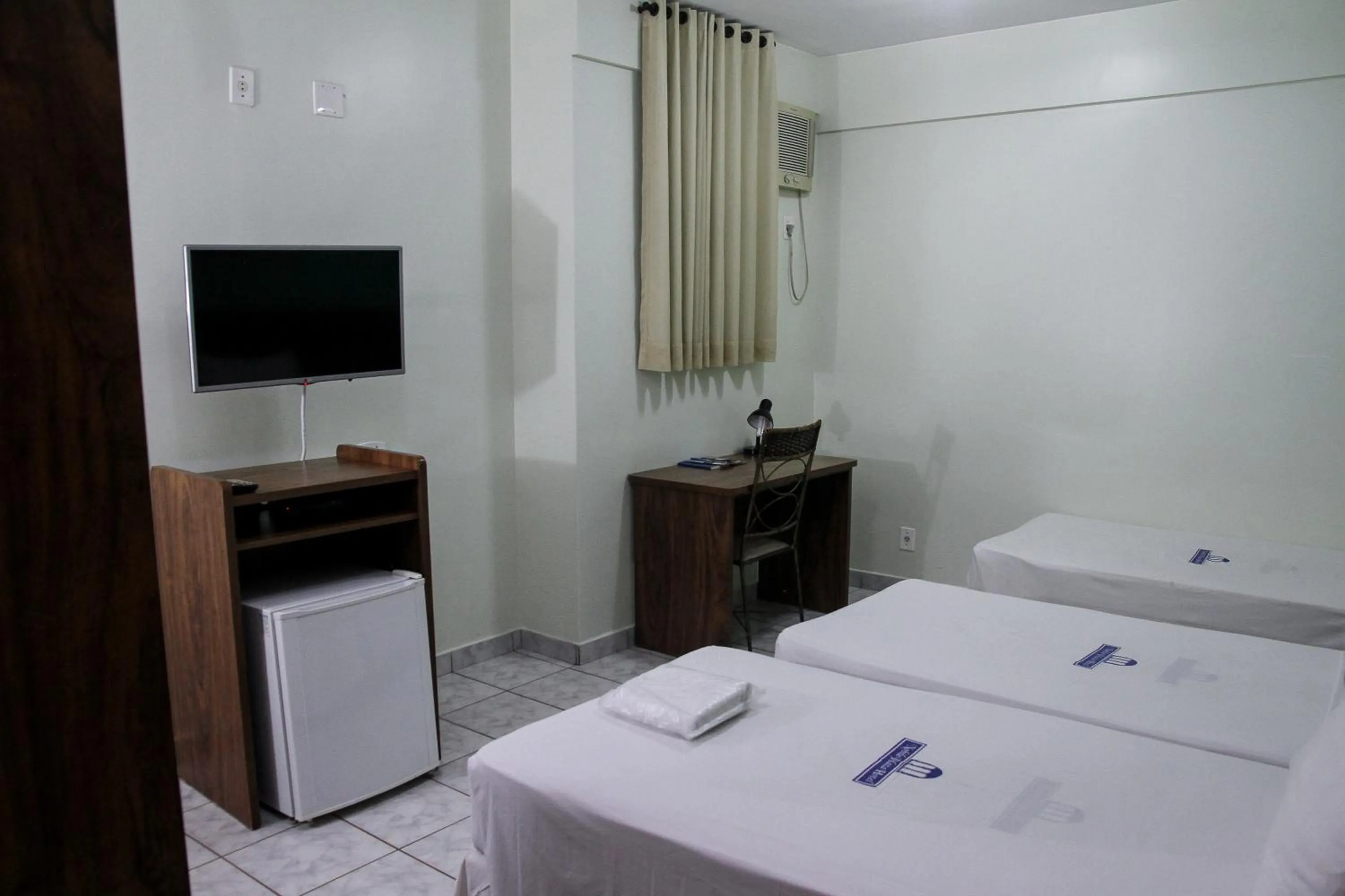 Bed in Nobile Plaza Hotel