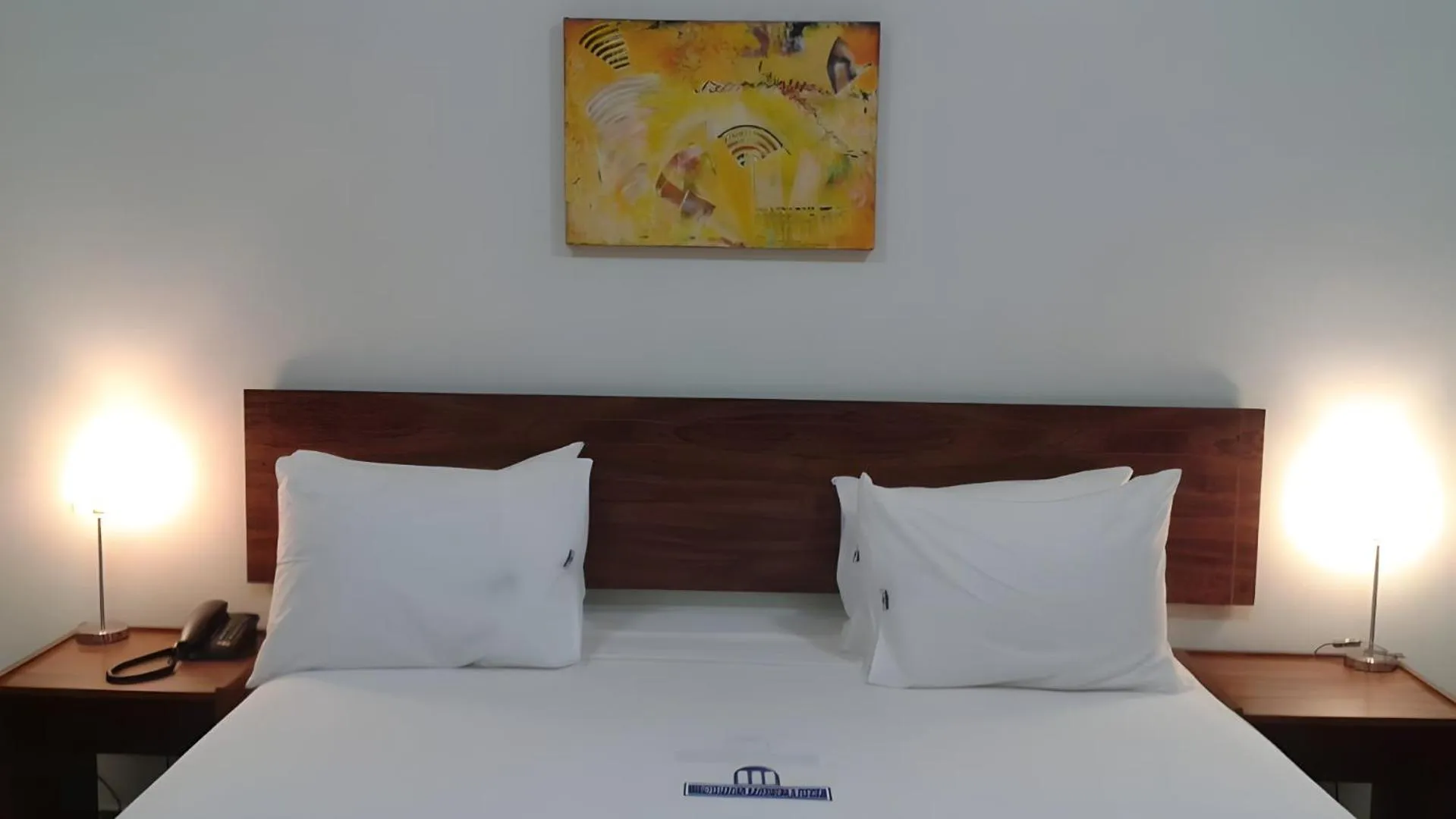 Bed in Nobile Plaza Hotel