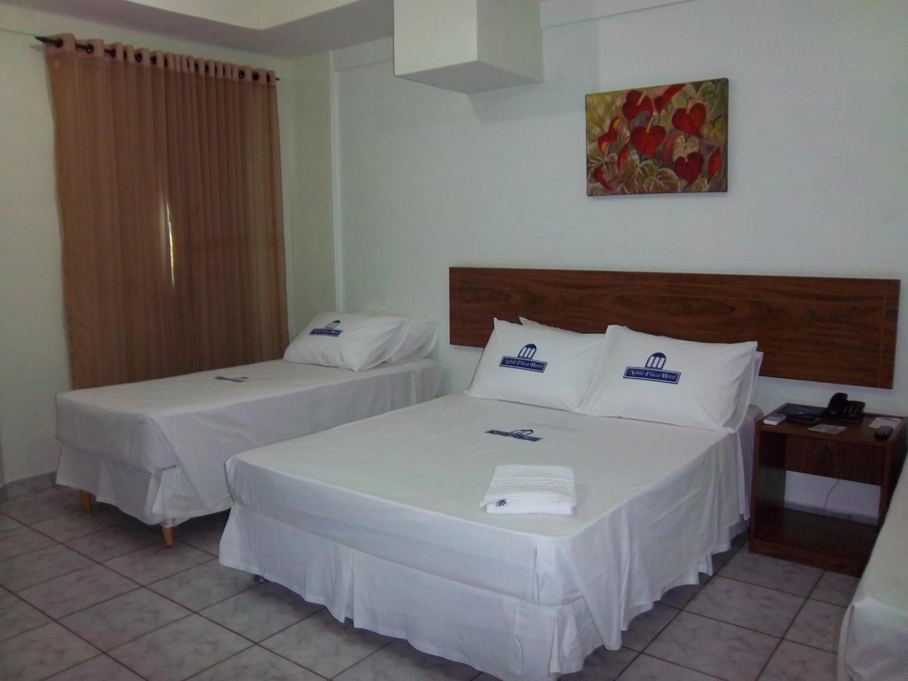 Bed in Nobile Plaza Hotel