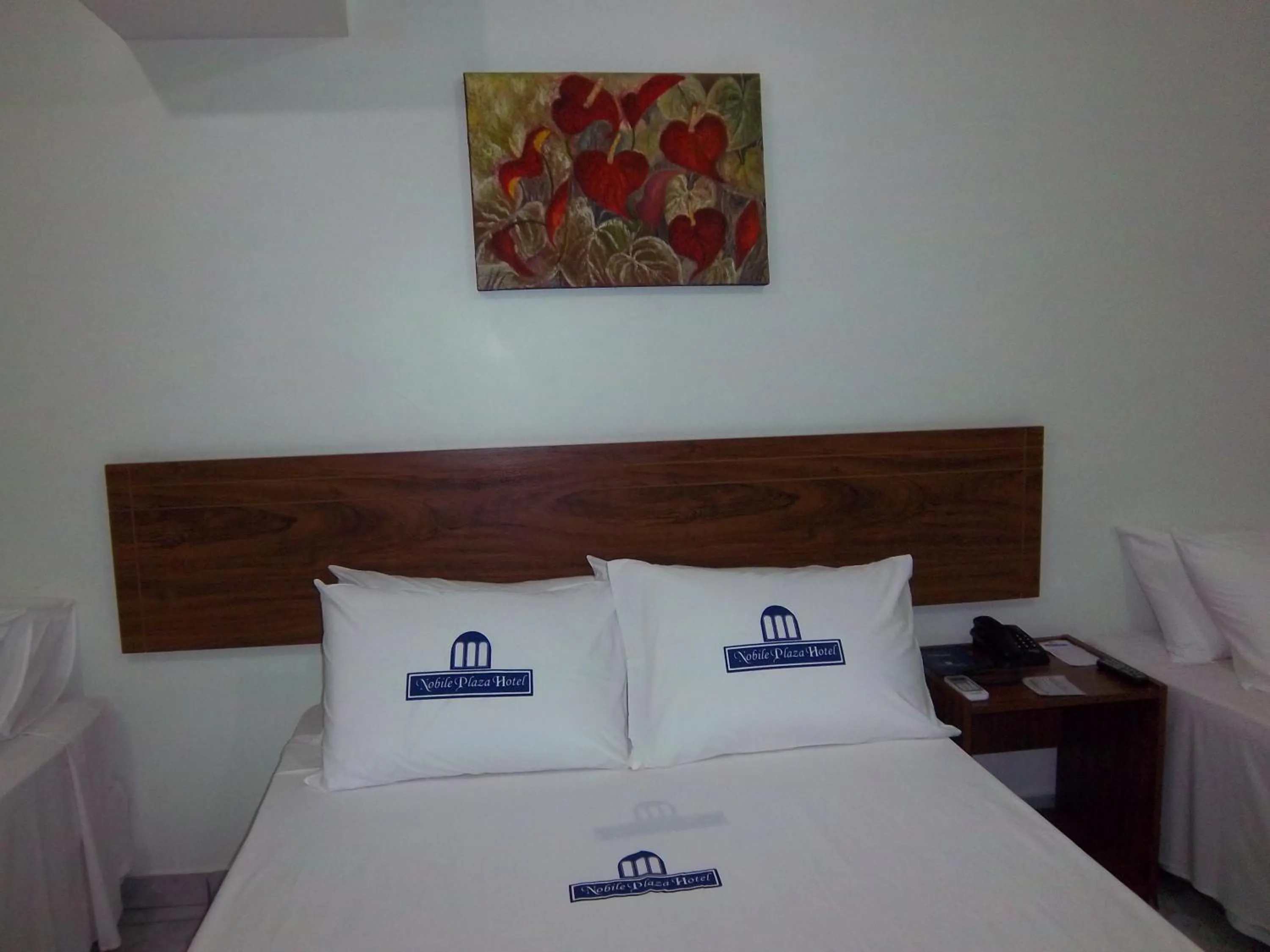 Bed in Nobile Plaza Hotel