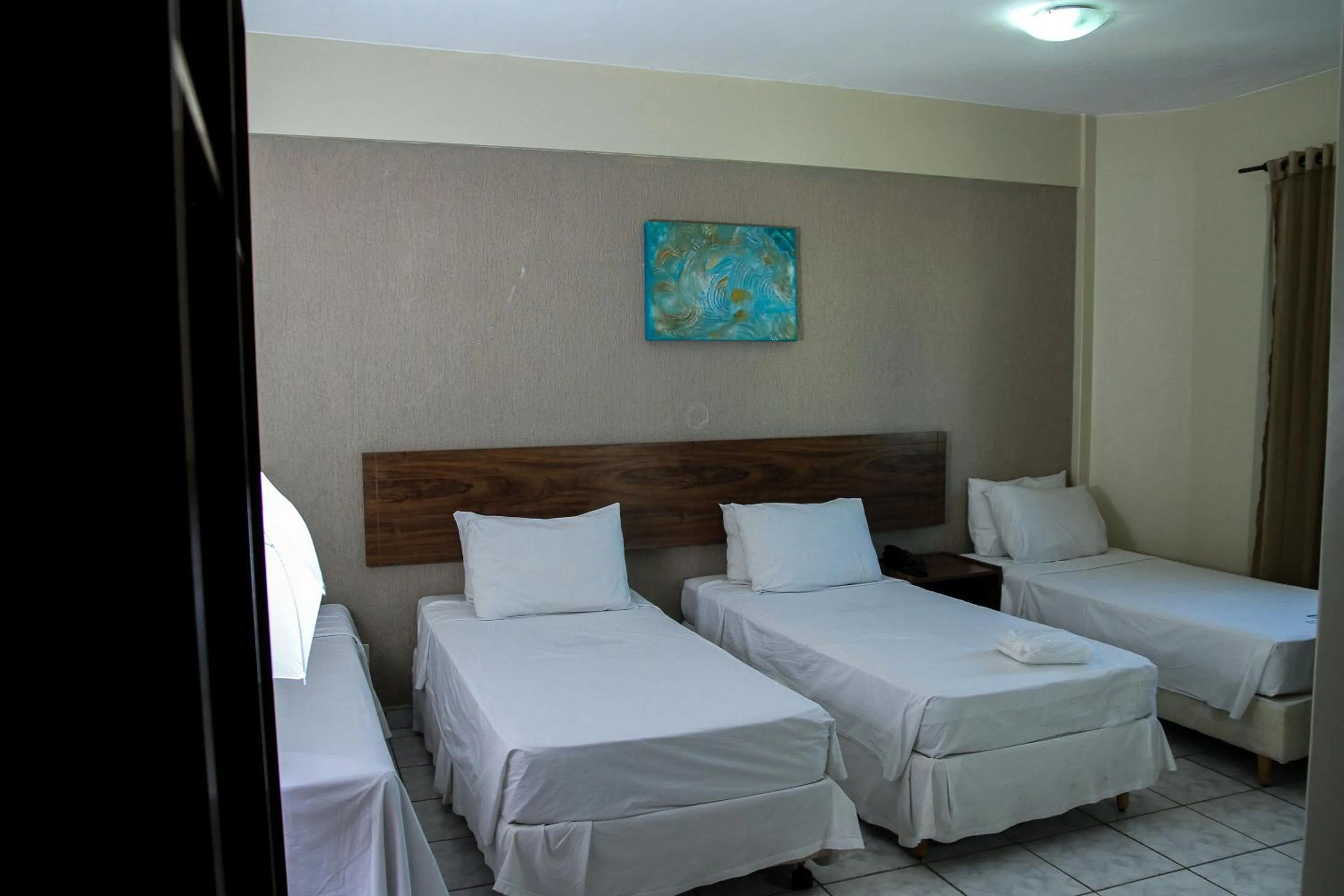 Bed in Nobile Plaza Hotel