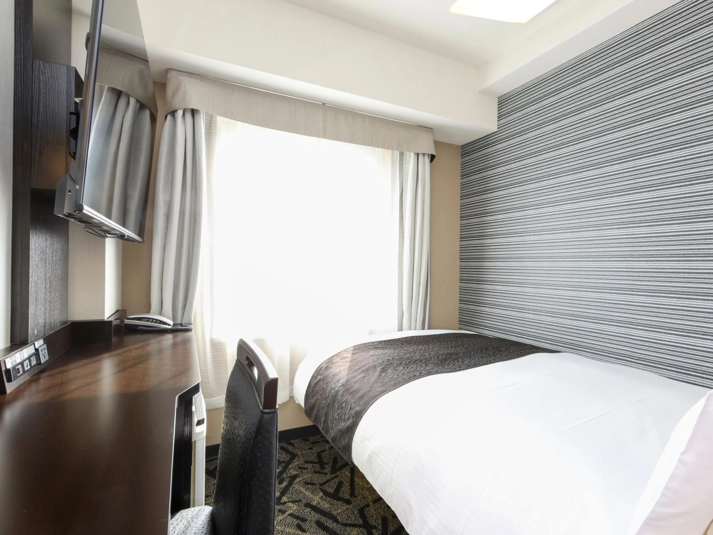 Bed in APA Hotel Chiba Yachiyo Midorigaoka