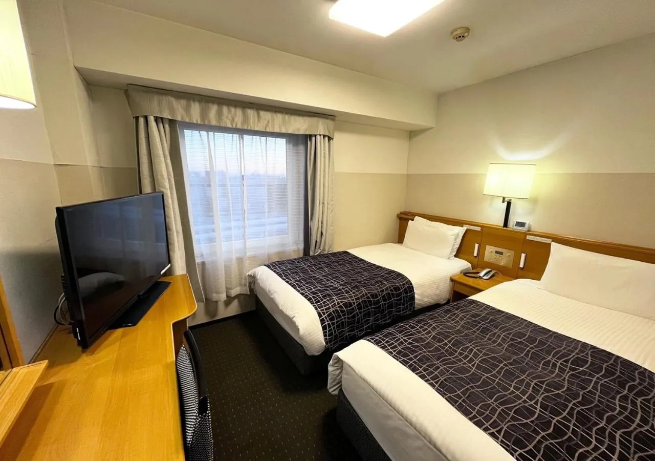 Photo of the whole room, Bed in APA Hotel Chiba Yachiyo Midorigaoka