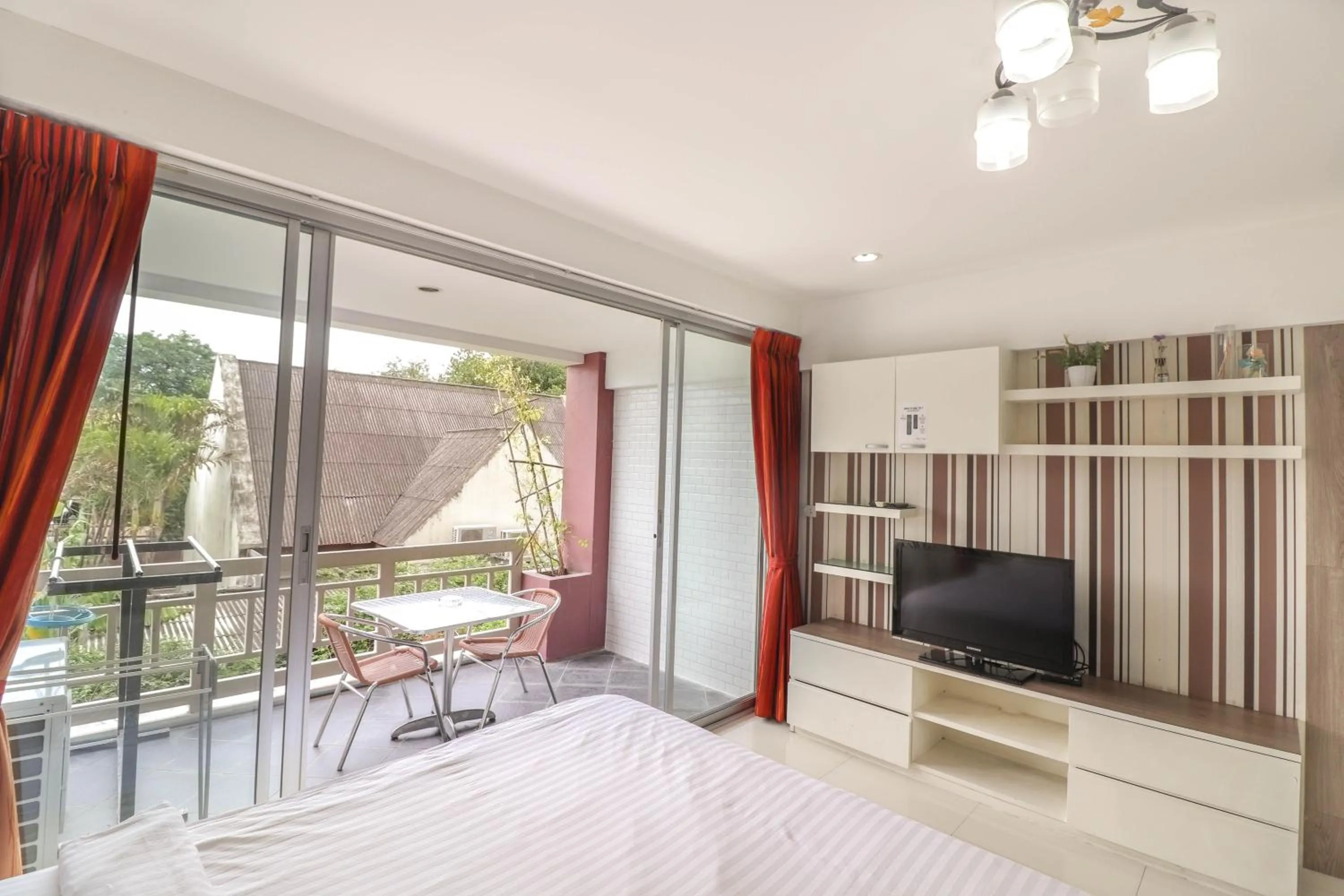 Photo of the whole room, Bed in Baan Sabai Rama IV Apartment