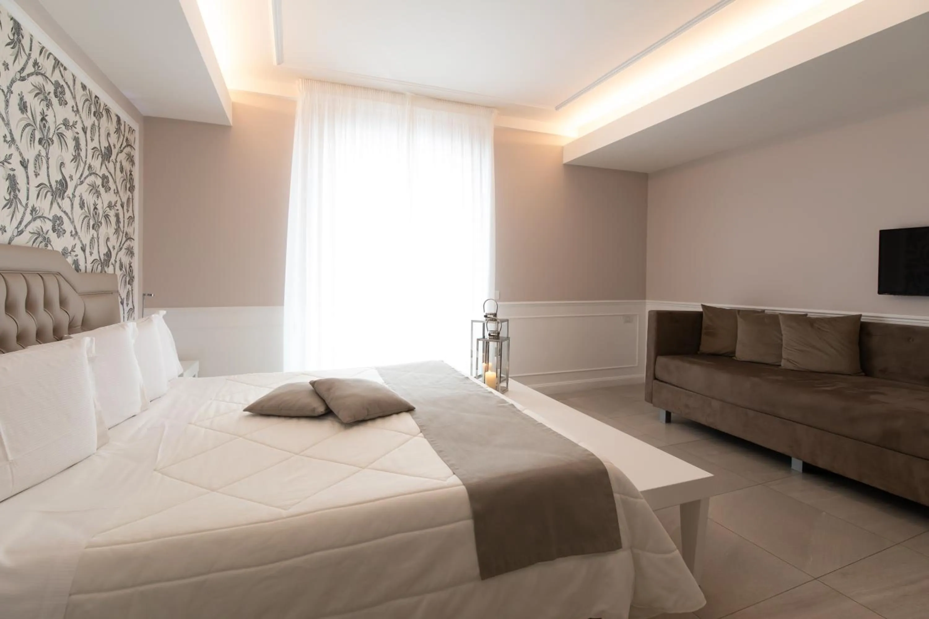 Bed in Bianco Riccio Suite Hotel