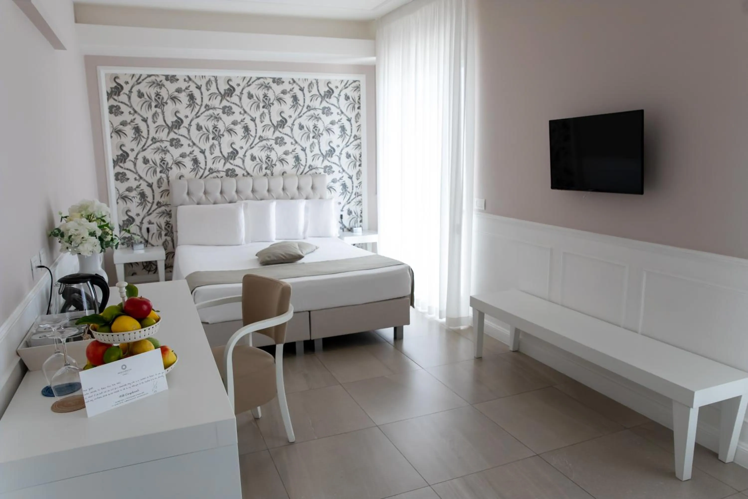 Bed in Bianco Riccio Suite Hotel