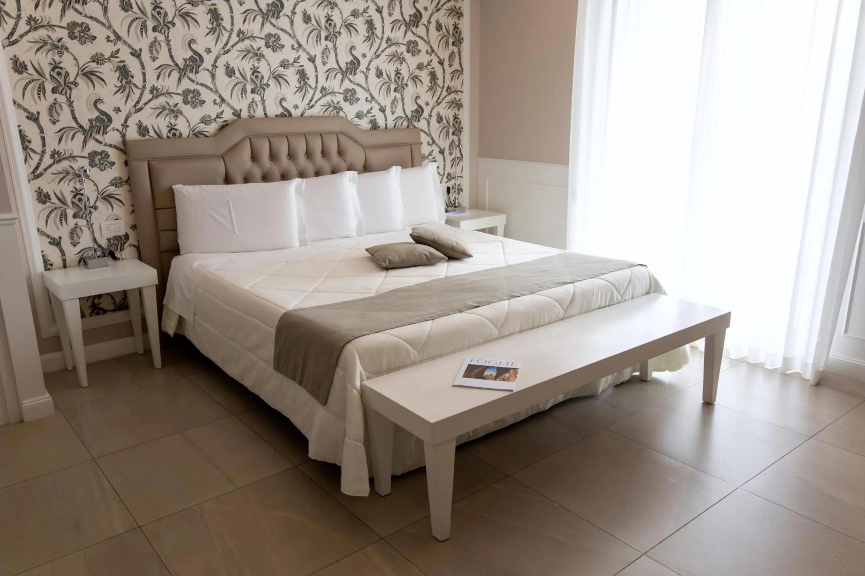 Bed in Bianco Riccio Suite Hotel