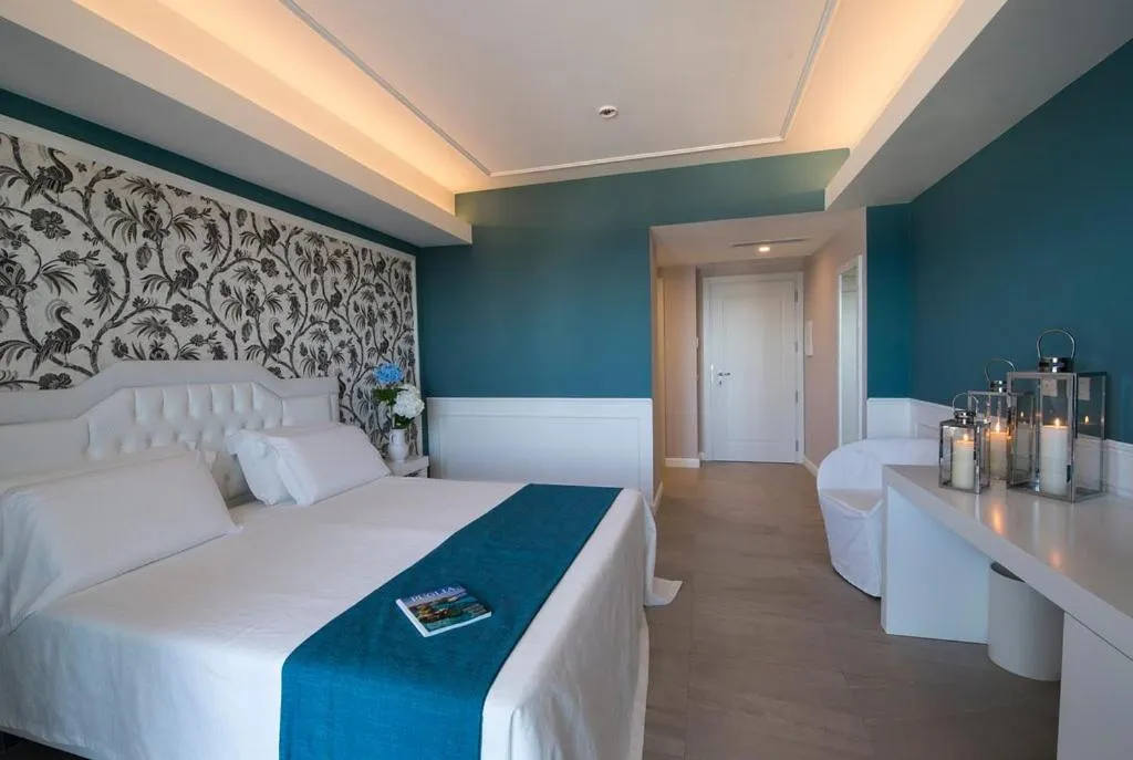 Bed in Bianco Riccio Suite Hotel