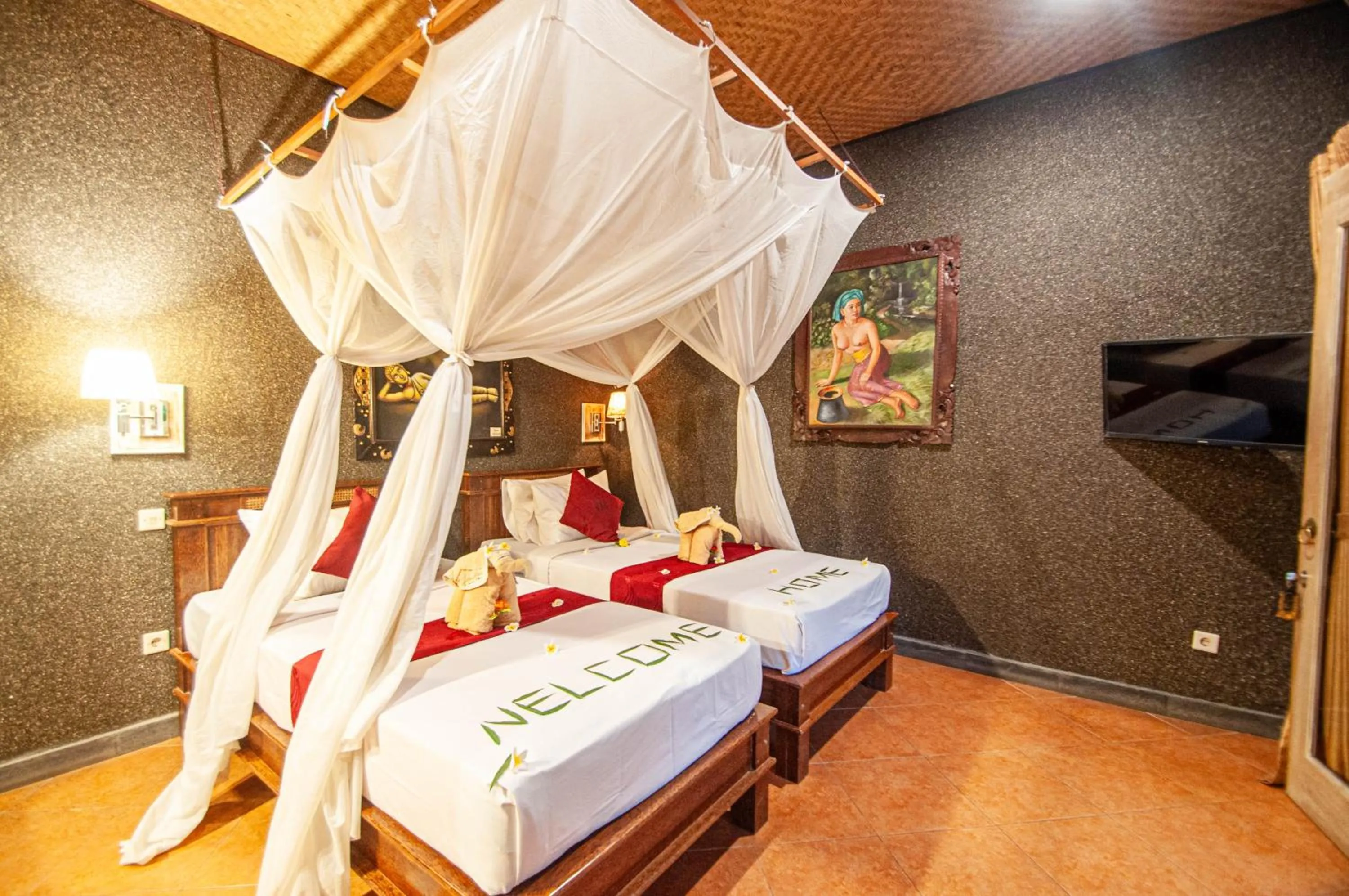 Bed in Kubuku Eco Dive Lodge and Yoga