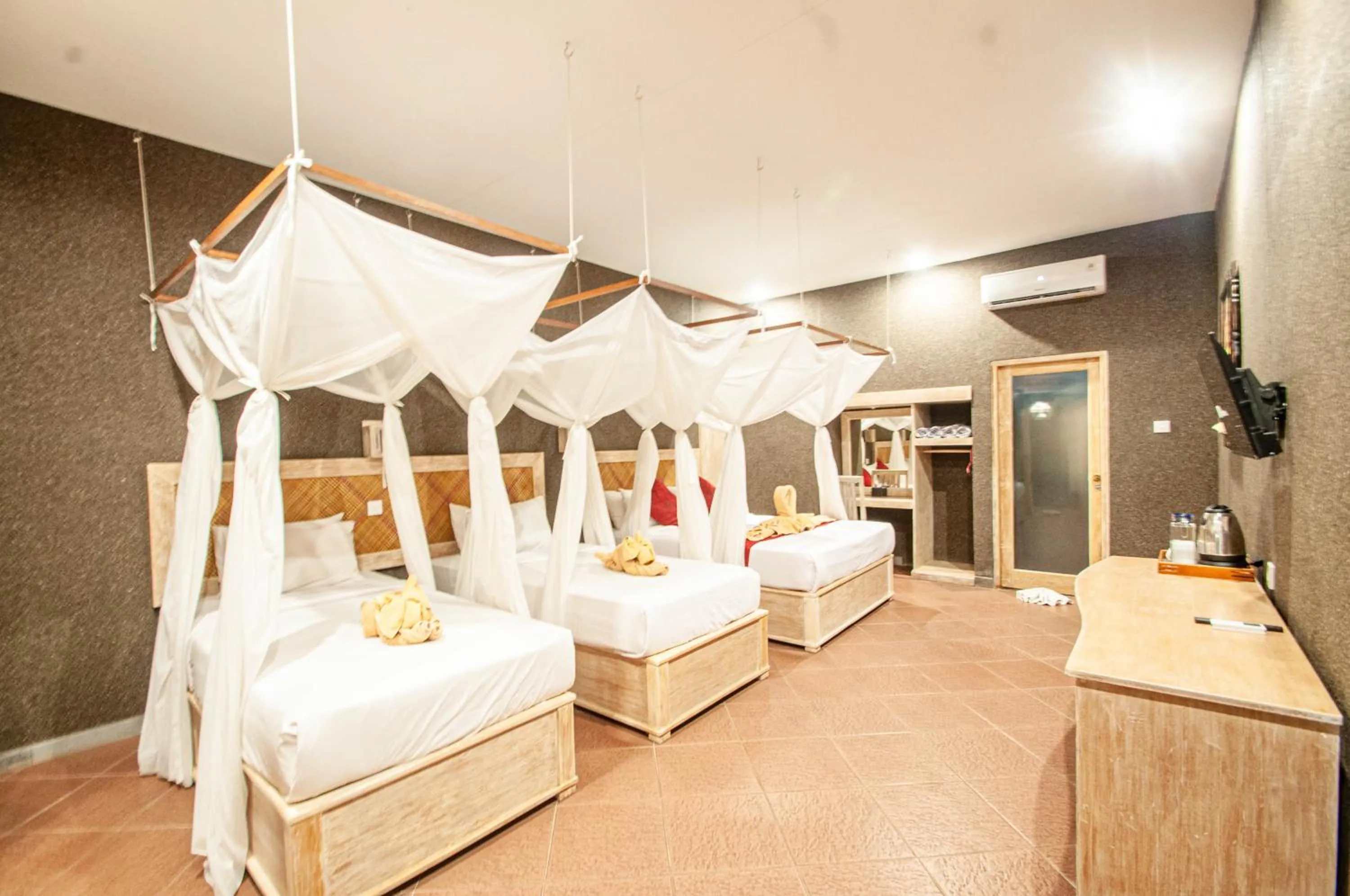 Bed in Kubuku Eco Dive Lodge and Yoga