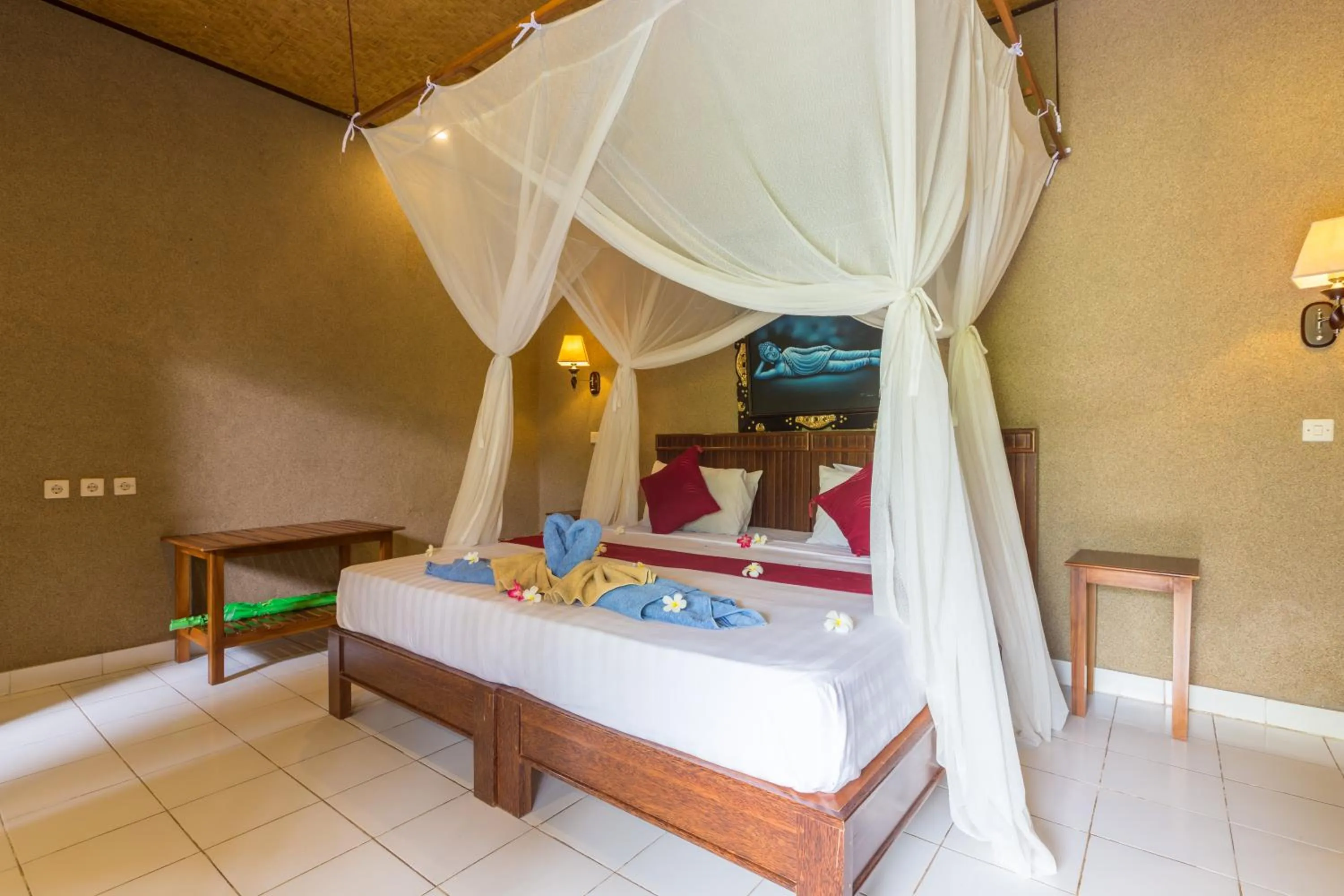 Bed in Kubuku Eco Dive Lodge and Yoga